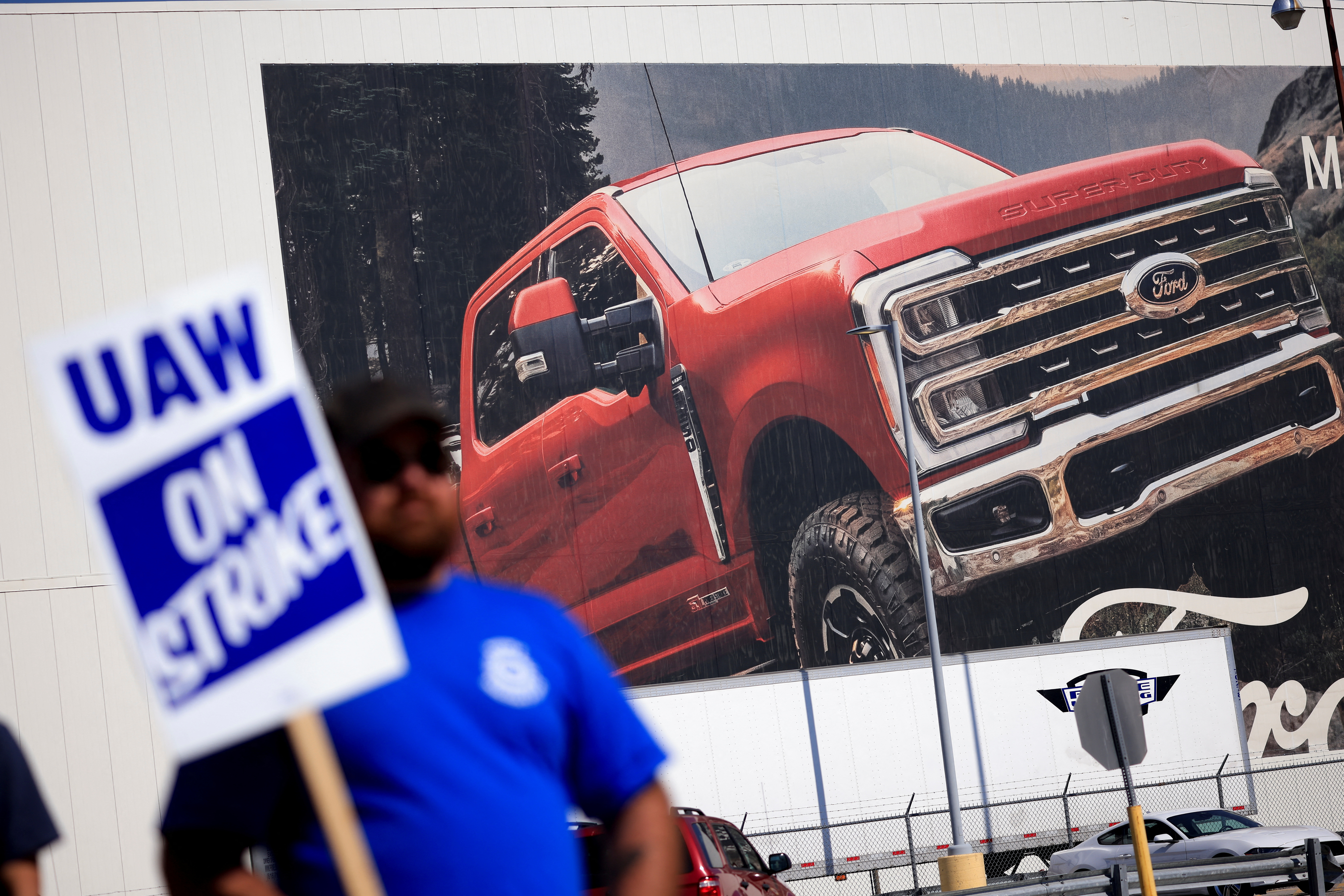 Ford earnings fall short of estimates after it strikes a tentative deal  with the United Auto Workers