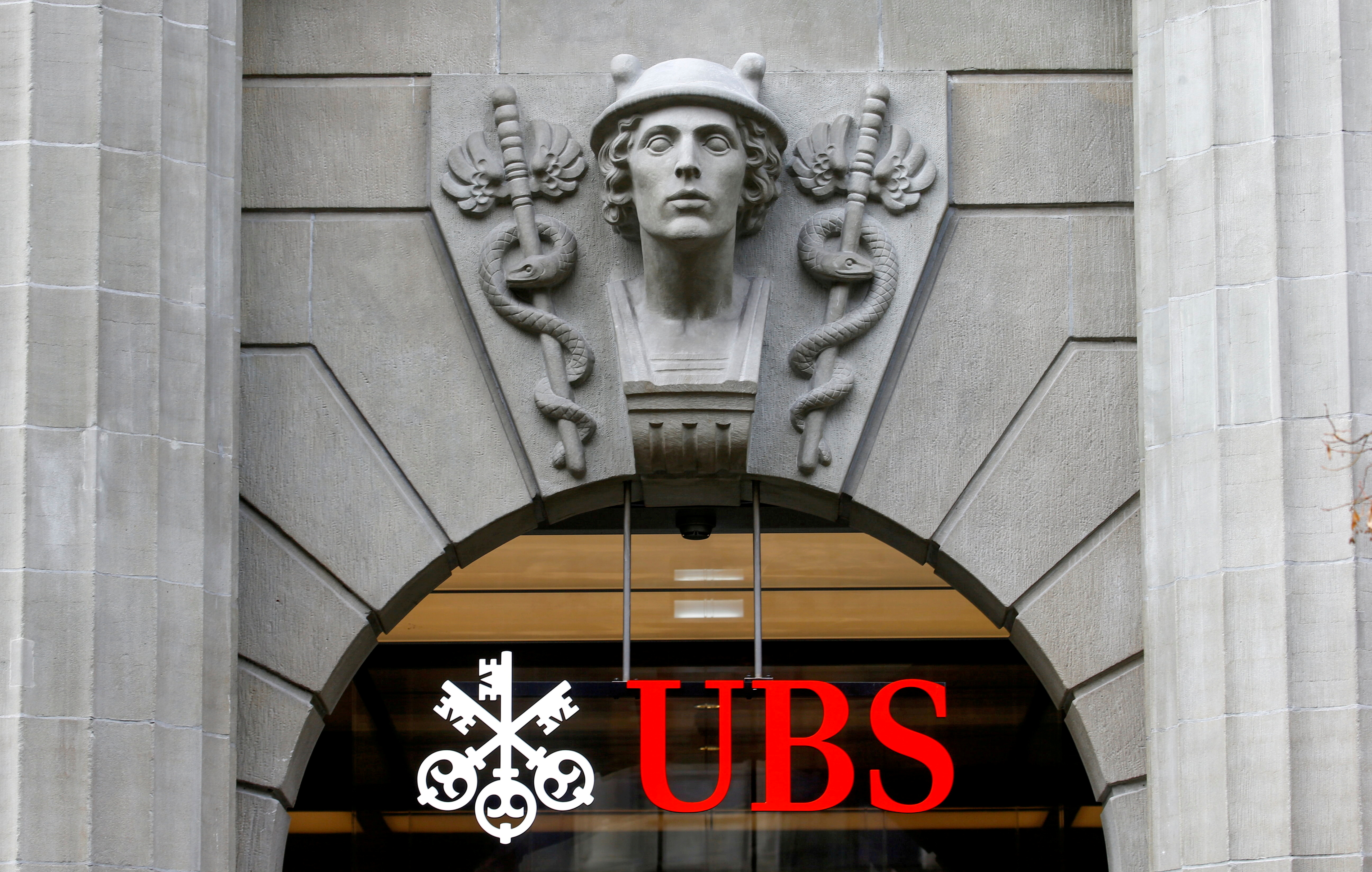 FILE PHOTO: The logo of Swiss bank UBS is seen at its headquarters in Zurich, Switzerland February 17, 2021. REUTERS/Arnd Wiegmann/File Photo