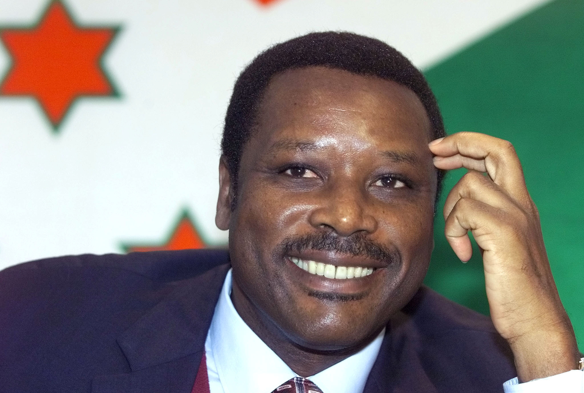 Burundi President Pierre Buyoya listens to reporters' questions during a news conference in Brussels