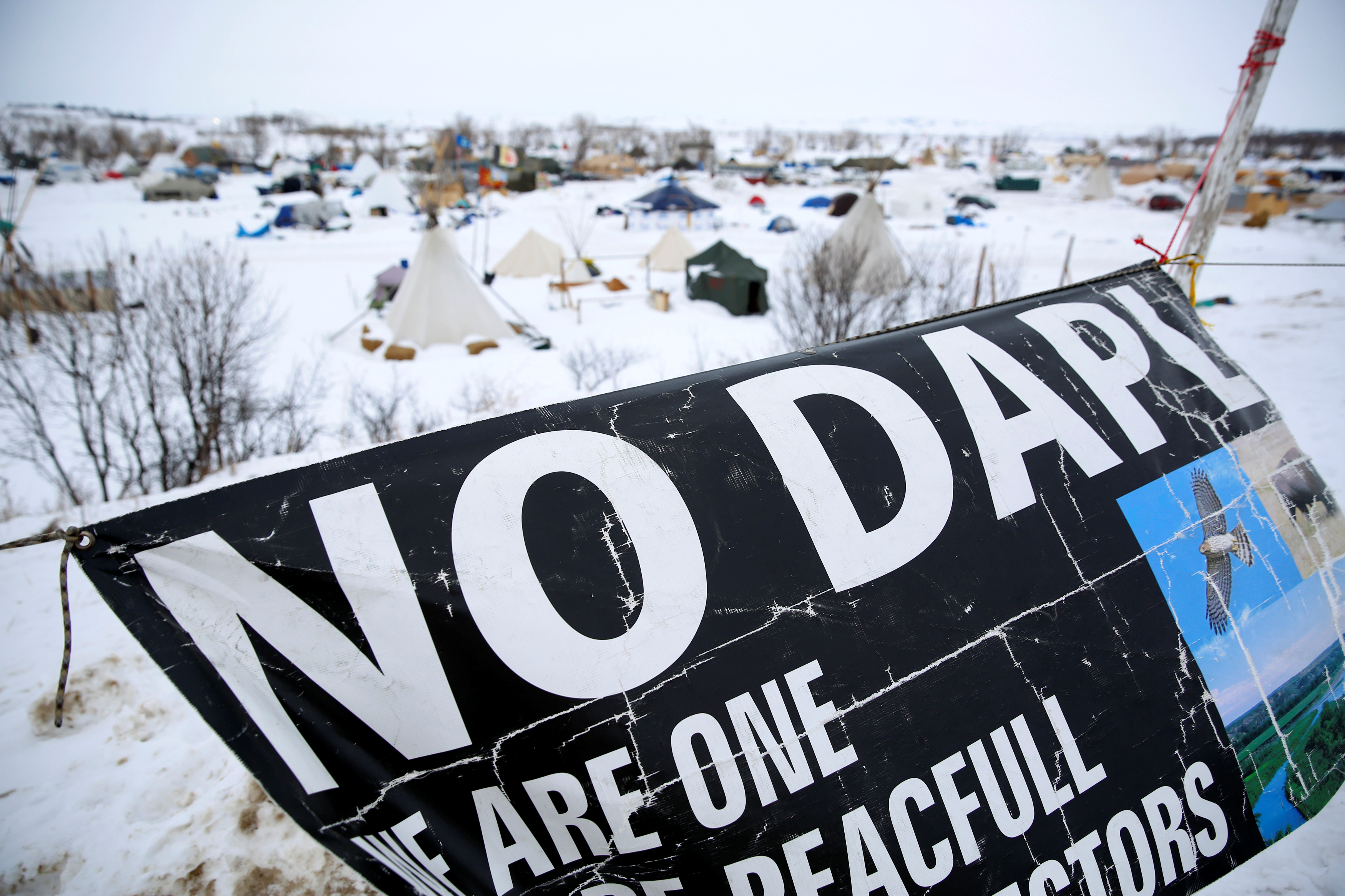 A banner flies in the Dakota Access Pipeline protest camp near Cannon Ball