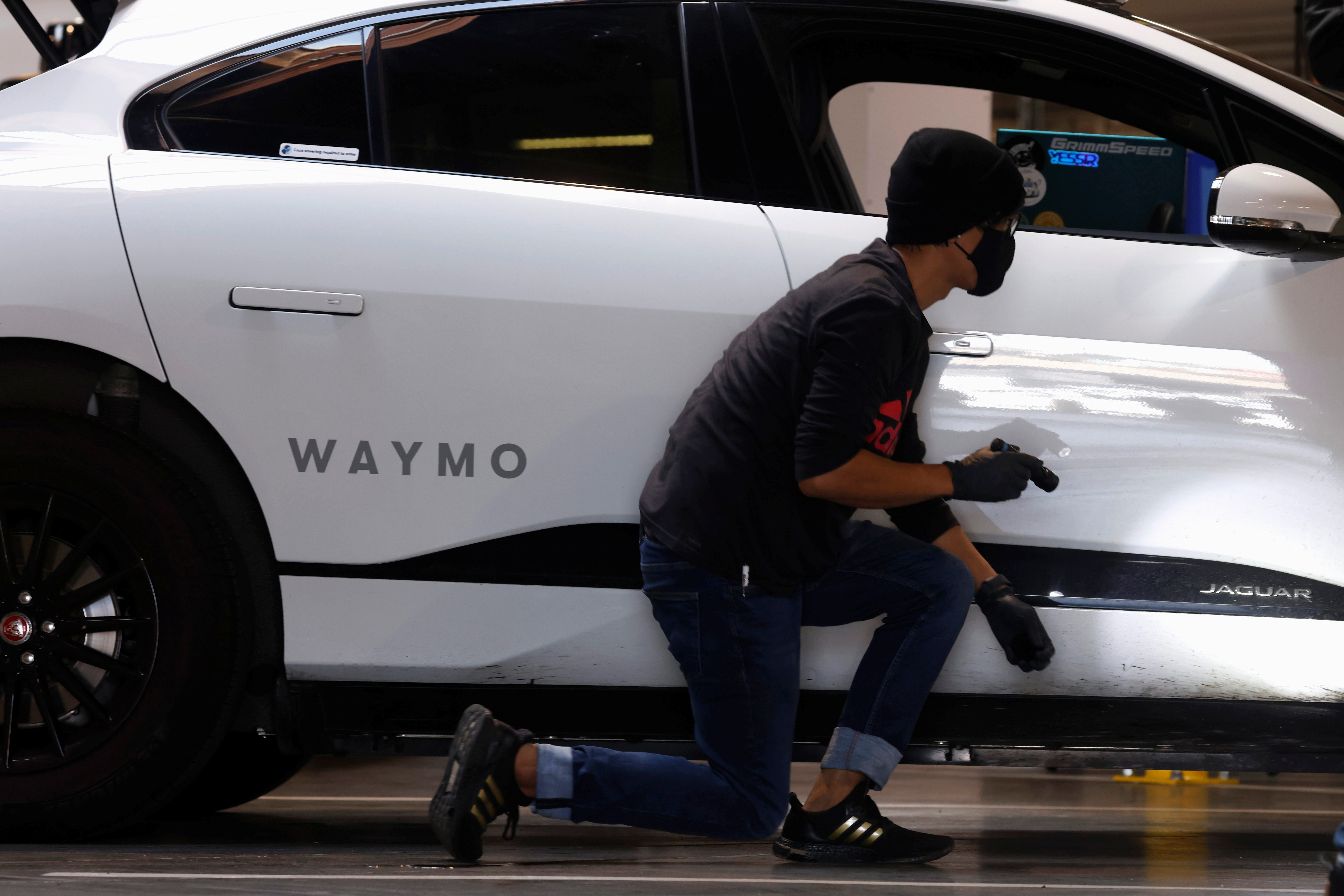 Jaguar I-Pace electric vehicles are tested at Waymo's operations center in San Francisco
