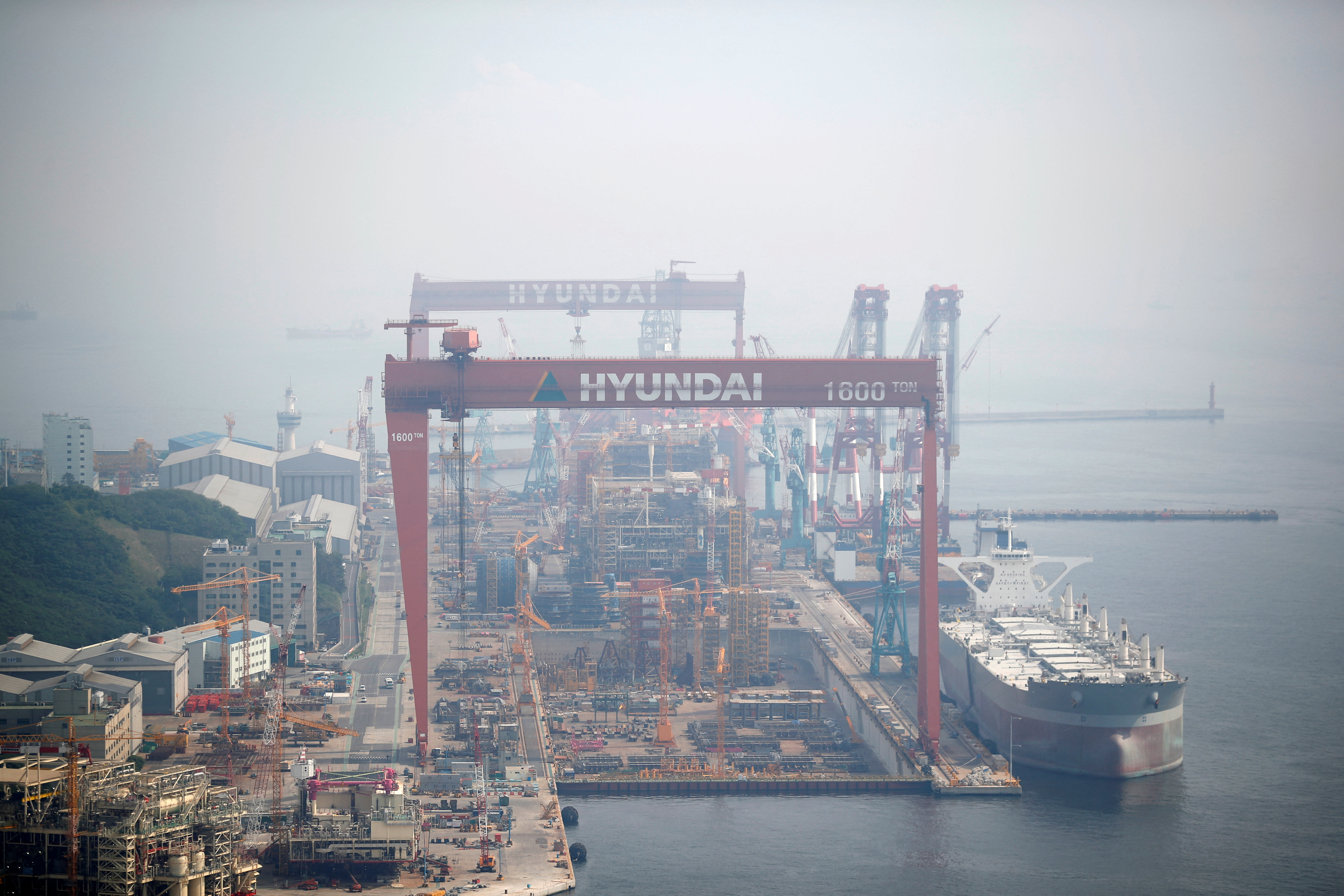 Giant cranes of Hyundai Heavy Industries are seen in Ulsan, South Korea, May 29, 2018. Picture taken on May 29, 2018.  REUTERS/Kim Hong-Ji