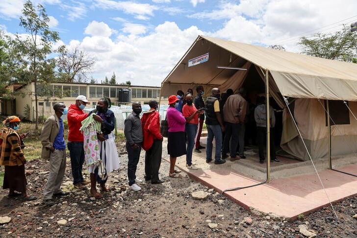 People stand in line to receive COVID-19 vaccine, in Narok