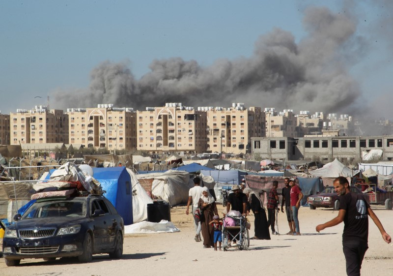 Smoke rises following an Israeli strike on a residential building, in Khan Younis