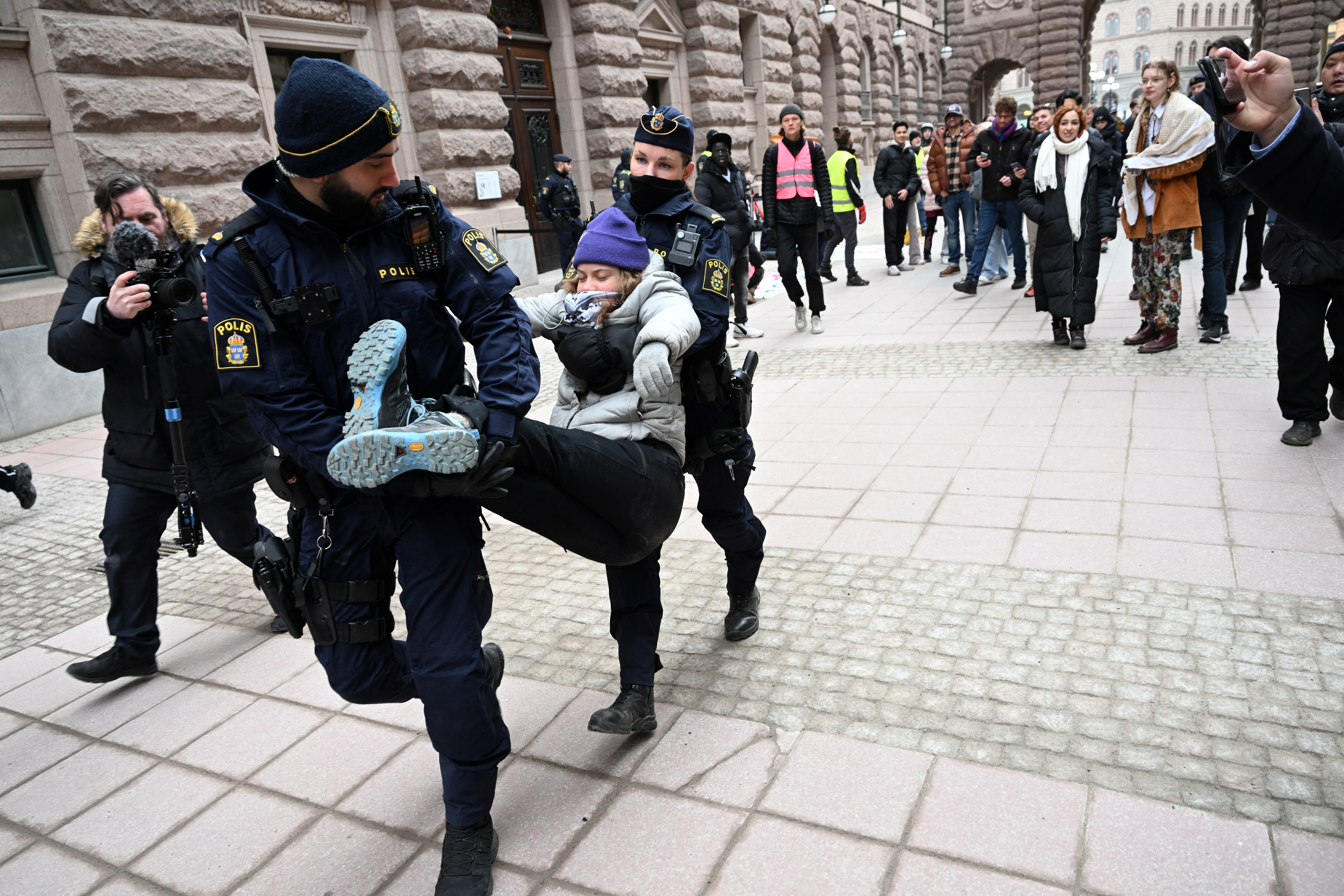 Greta Thunberg and other climate activists demonstrate outside parliament in Stockholm