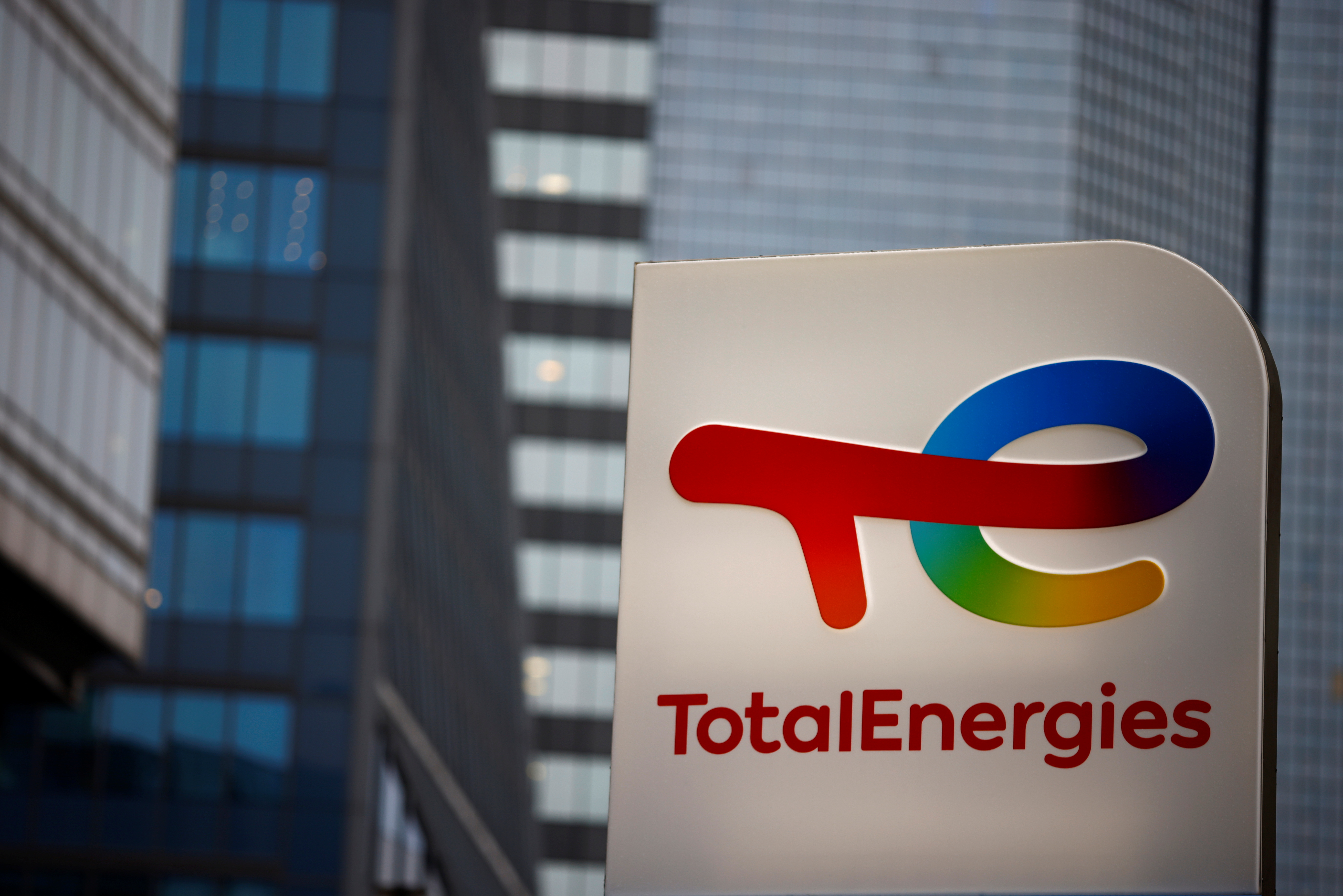 The logo of French oil and gas company TotalEnergies is pictured at an electric car charging station in Courbevoie