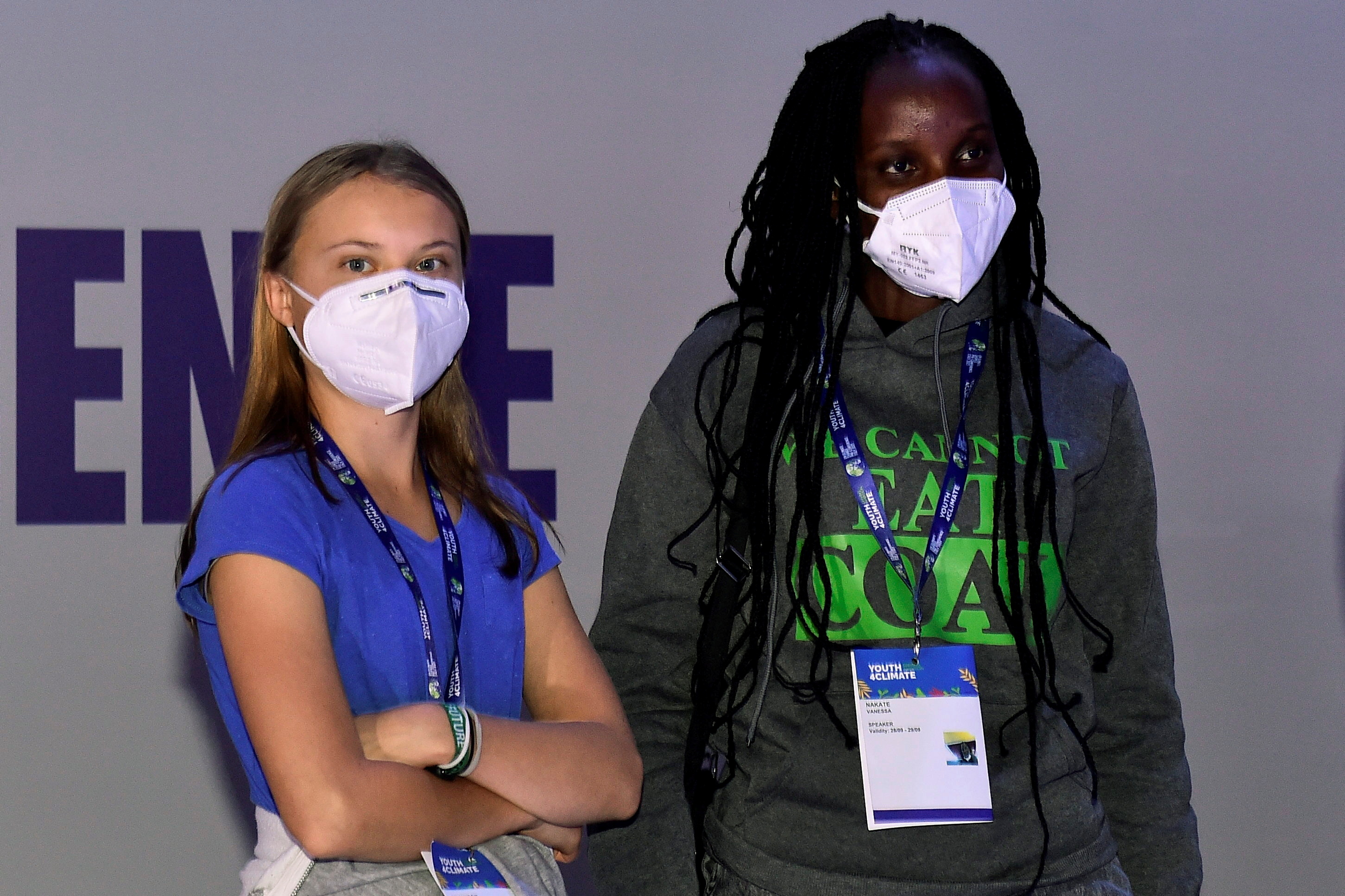 Climate activists Greta Thunberg and Vanessa Nakate attend the Youth4Climate pre-COP26 conference in Milan, Italy, September 28, 2021. REUTERS/Flavio Lo Scalzo