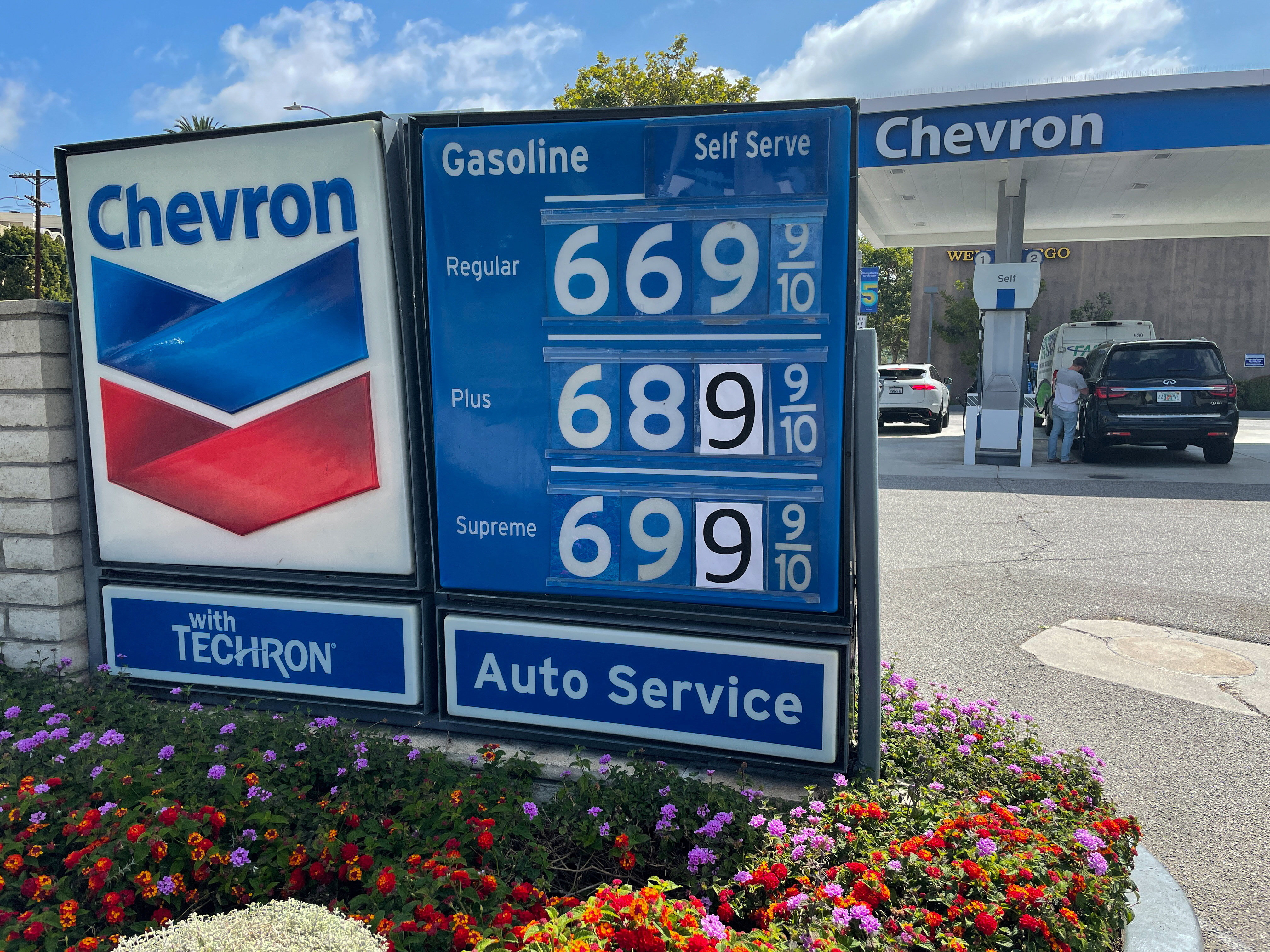 Gas prices are advertised at Chevron station in Los Angeles