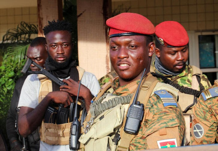 Burkina Faso's new military leader Ibrahim Traore is escorted by soldiers in Ouagadougou