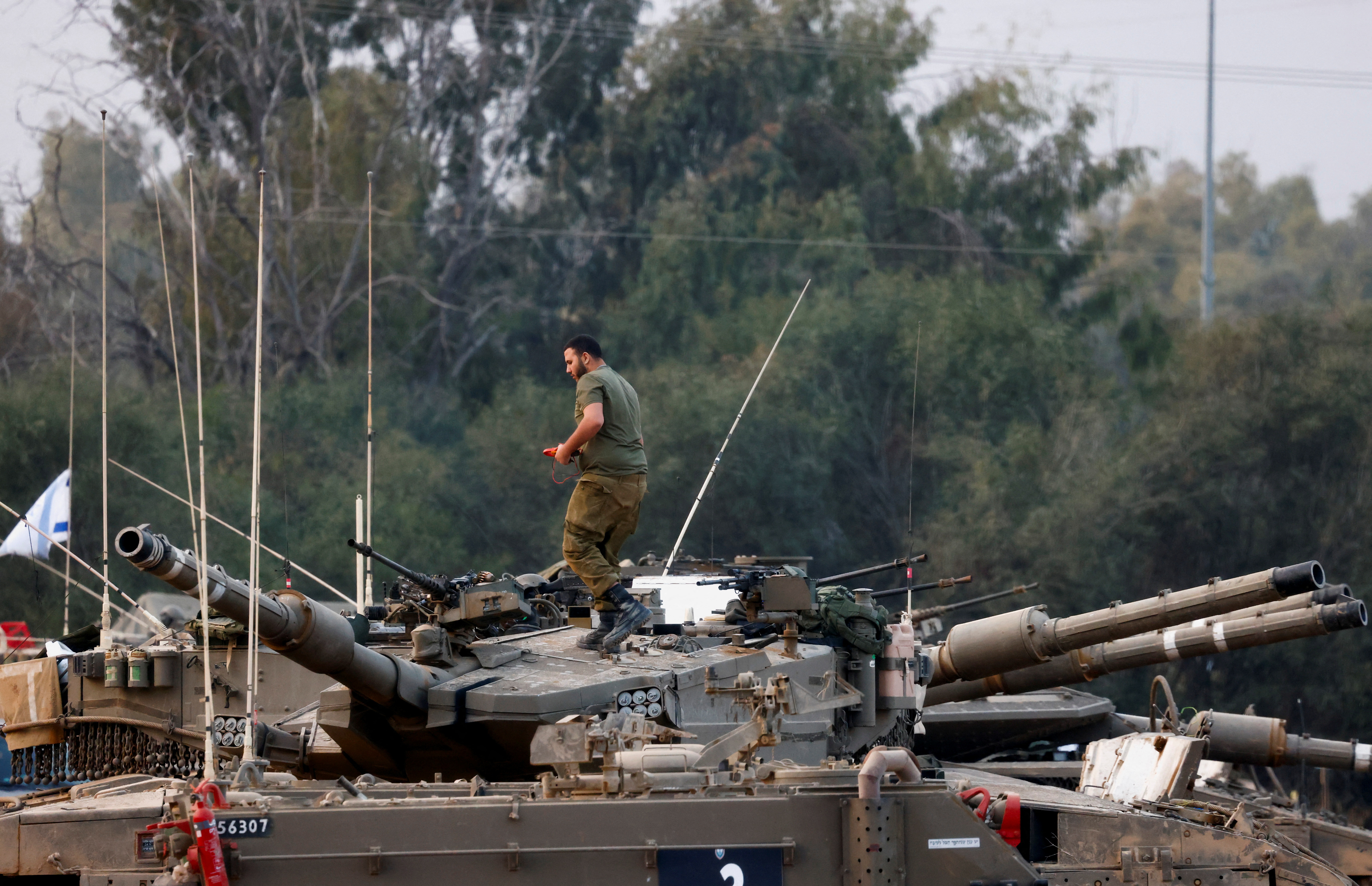 An Israeli bulldozer is seen outside the border with central Gaza, in southern Israel