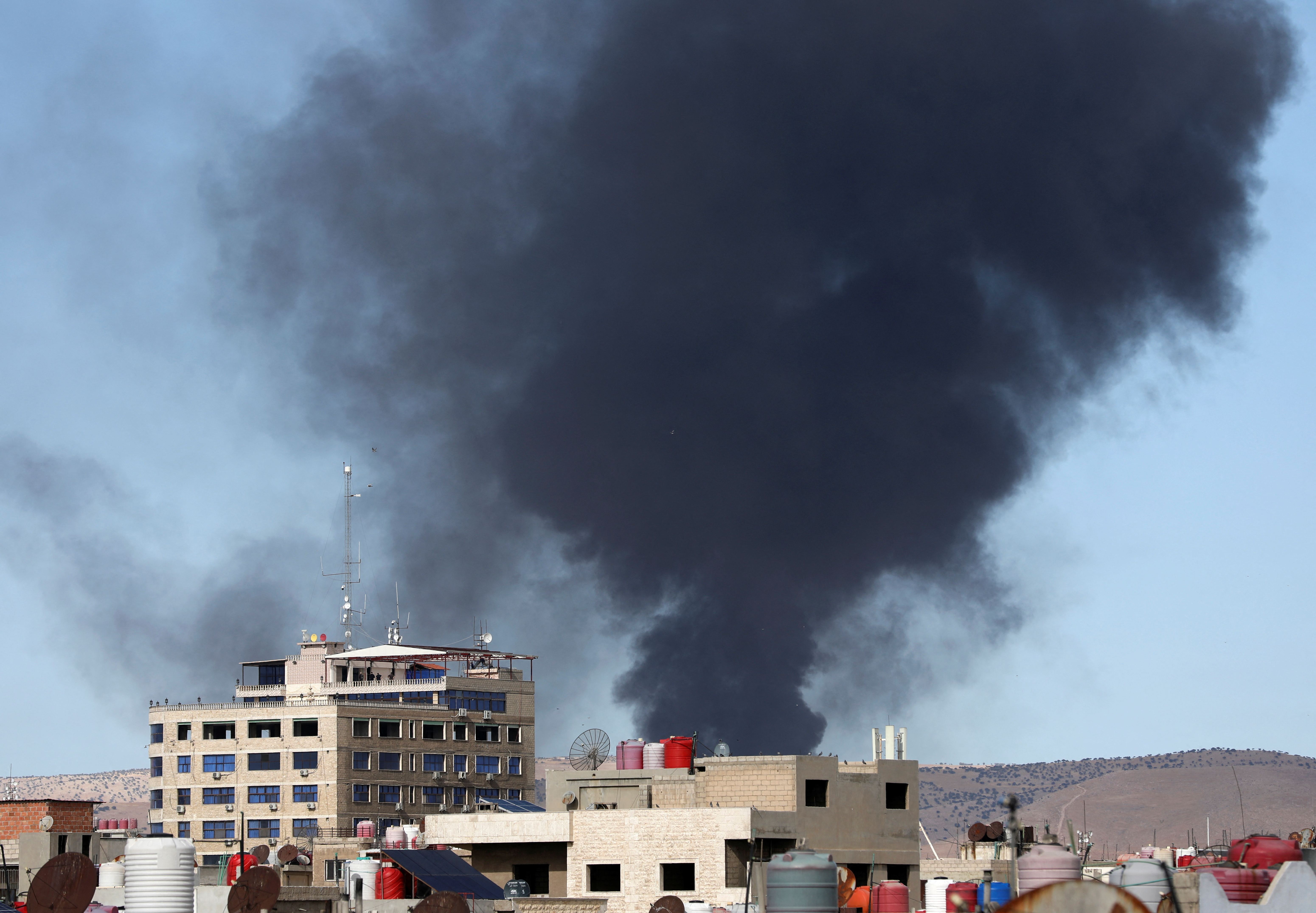 Smoke rises from Qamishli