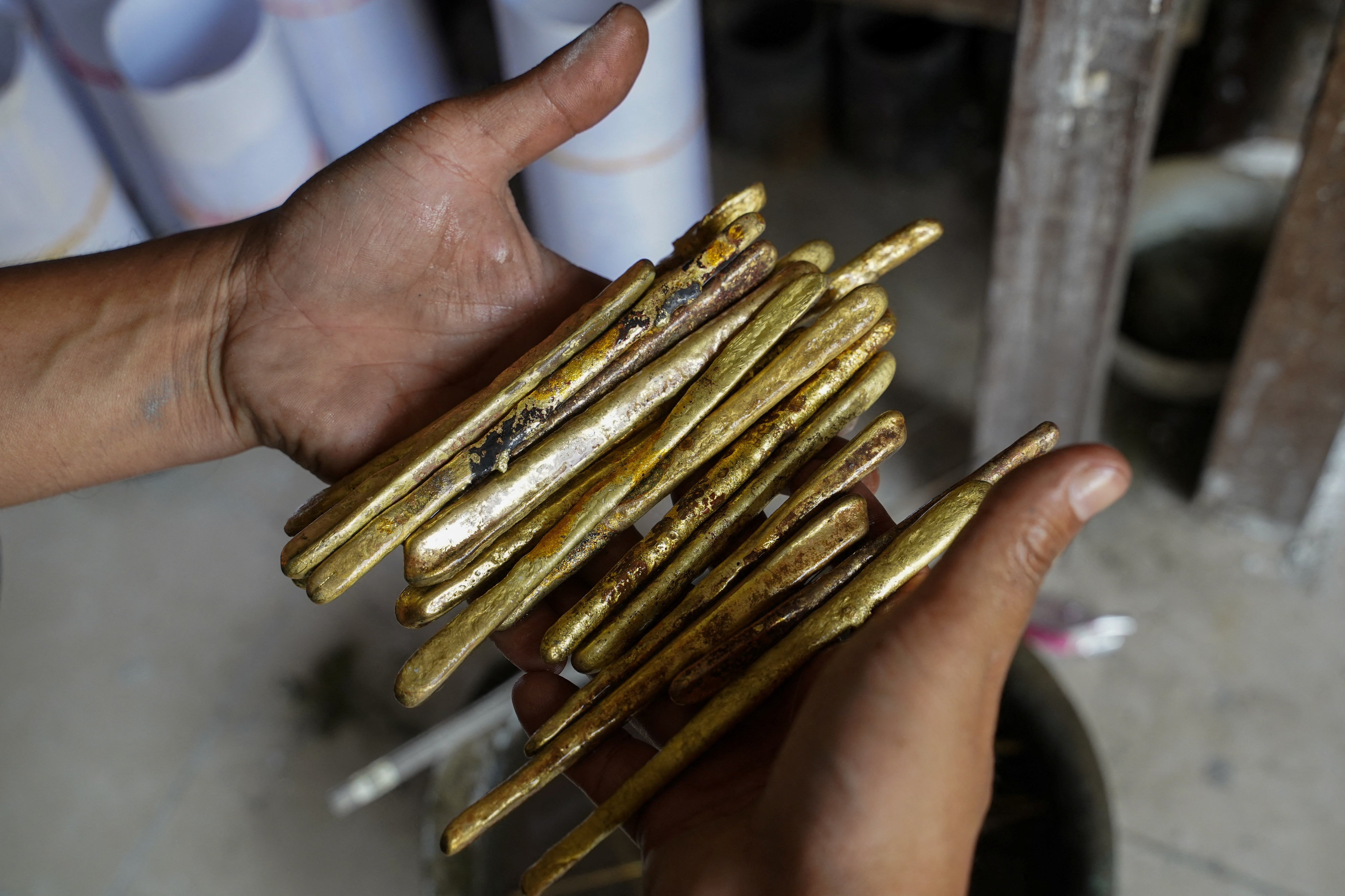 Cambodian goldsmith makes bullet casing jewellery to promote peace, in Phnom Pehn
