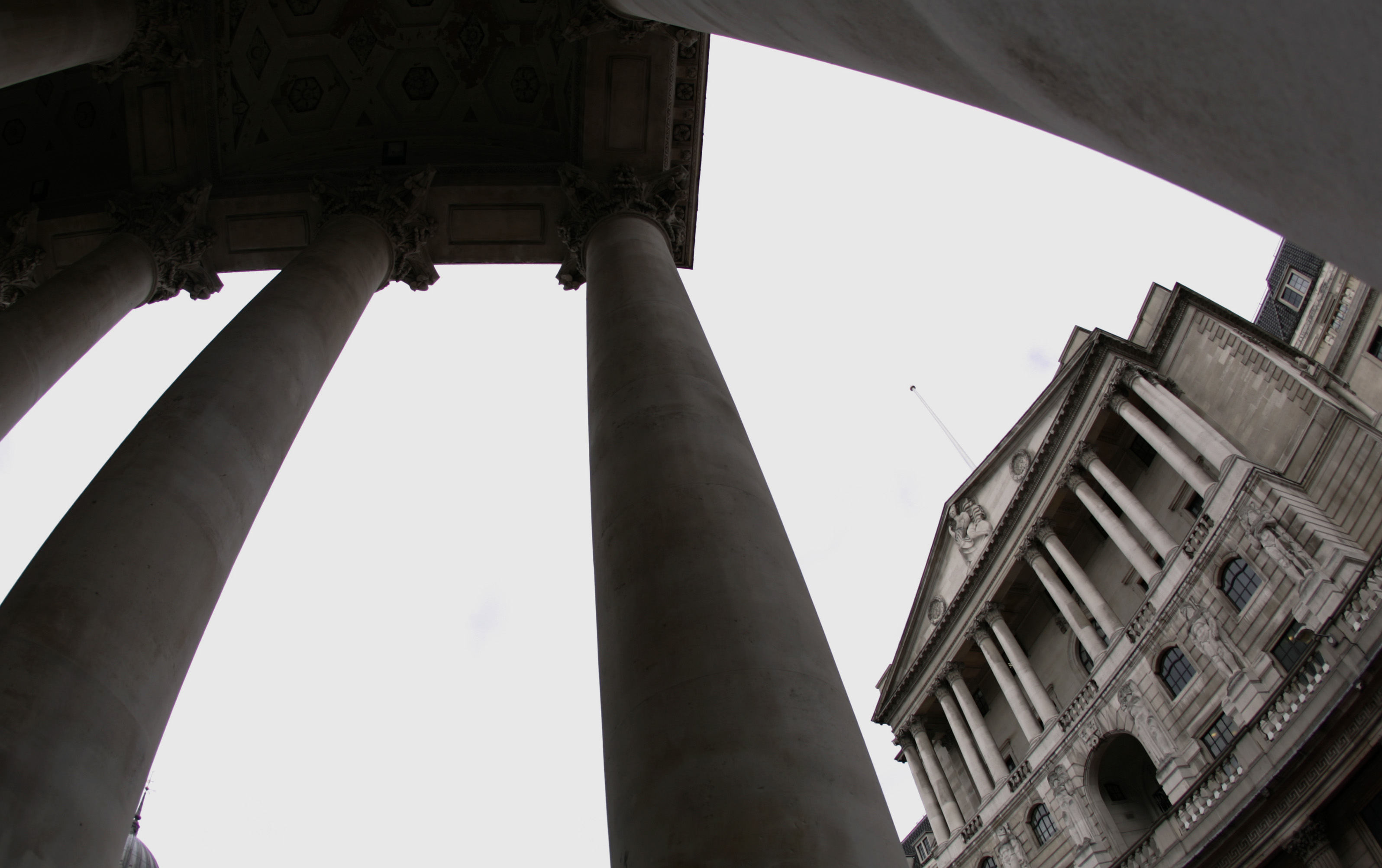 The Bank of England is seen through the columns of a neighbouring building in London