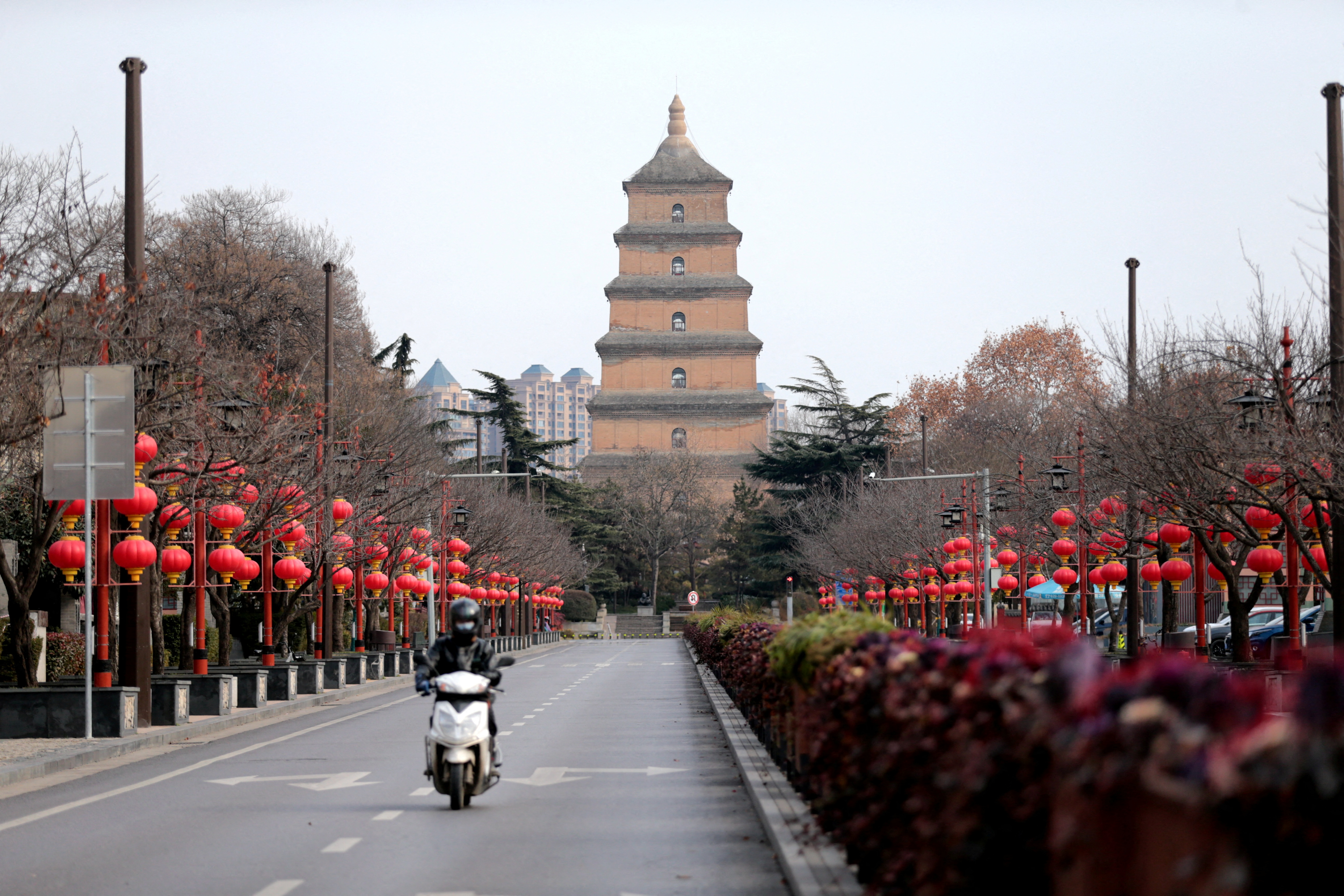 Rider travels on an empty road following lockdown measures in Xian