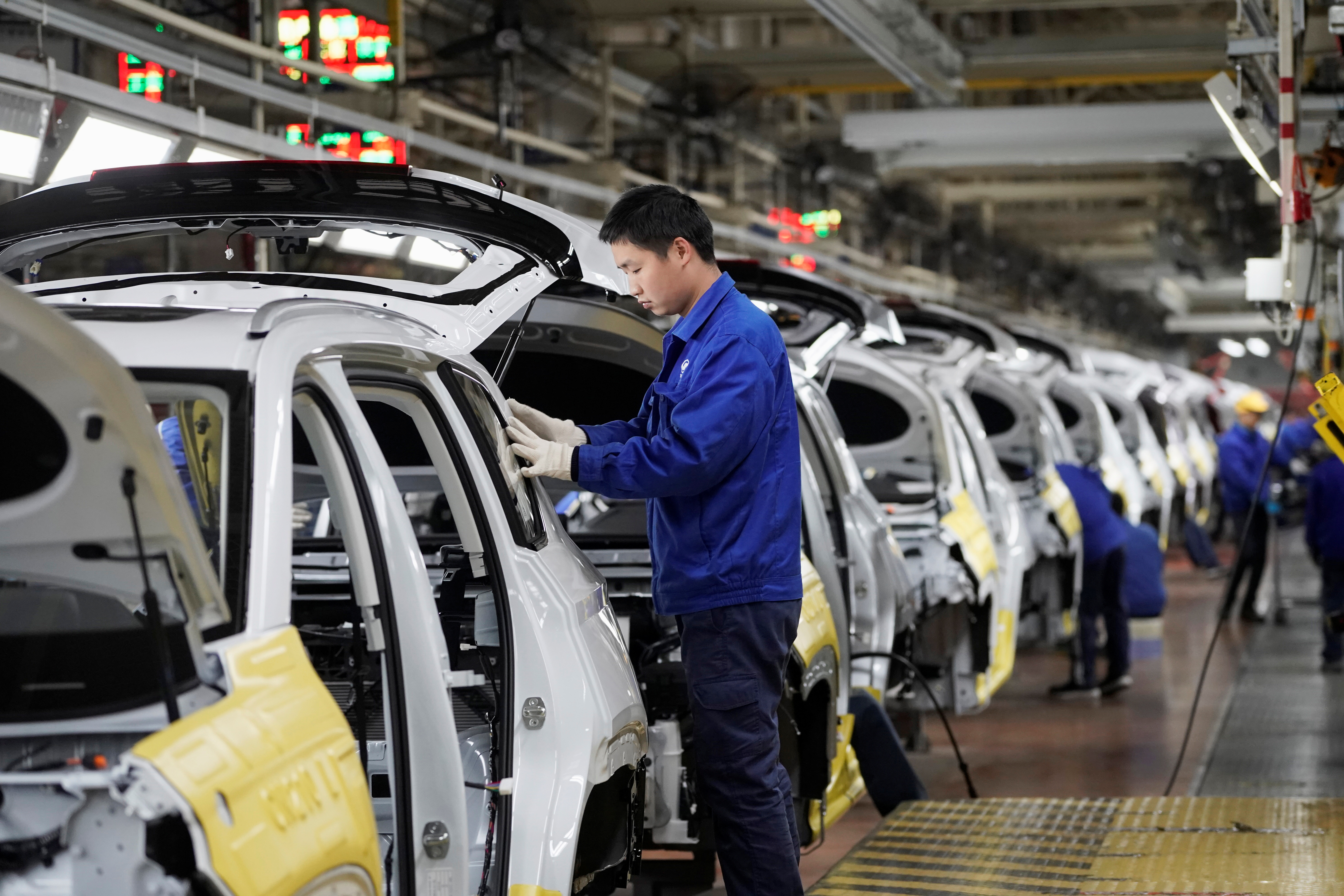 Employees work at a final assembly plant operated by General Motors Co and its local joint-venture partners in Liuzhou,