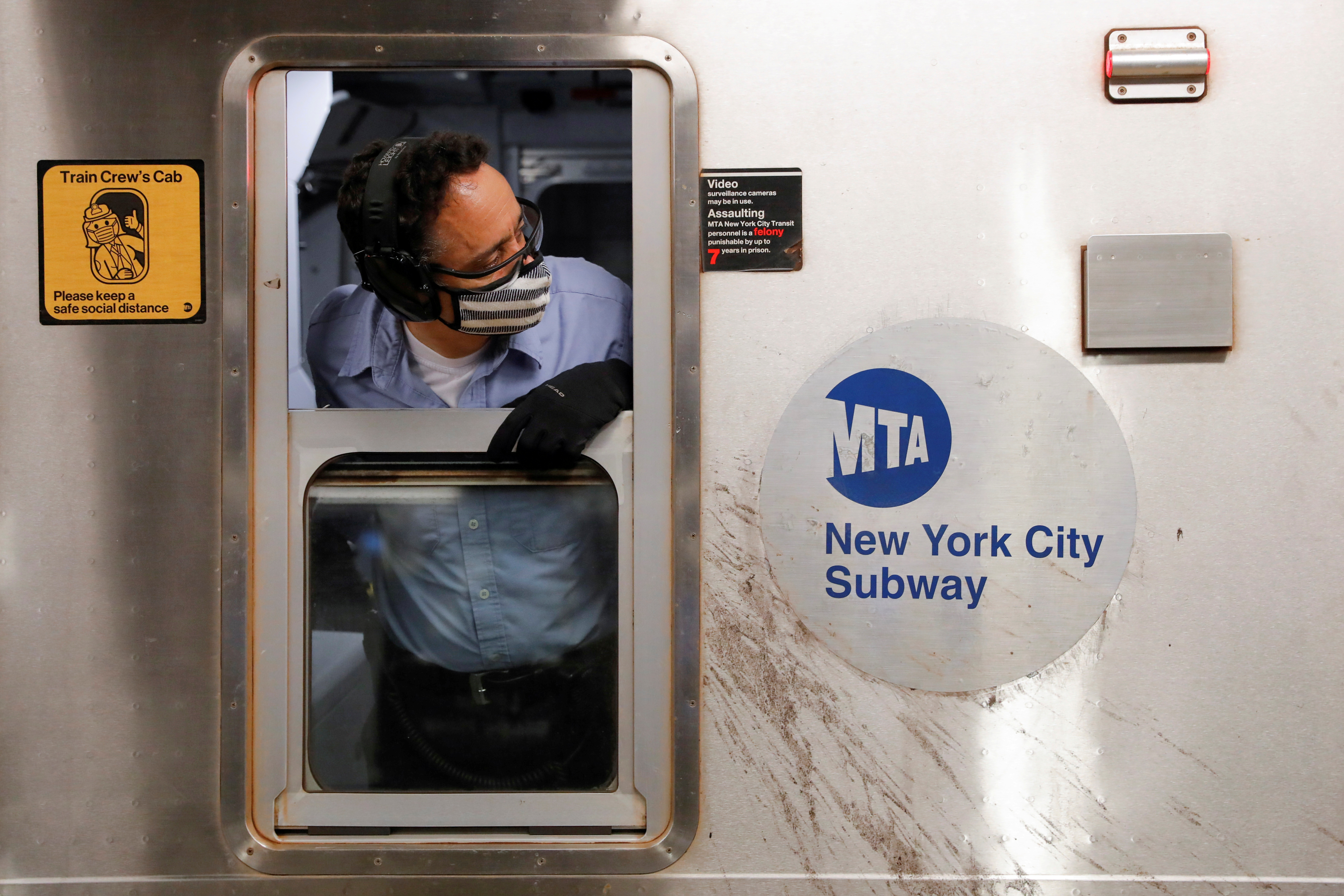 An MTA worker is seen on the subway after The Port Authority of New York and New Jersey and the Metropolitan Transportation Authority (MTA) announced a mandatory coronavirus vaccination or weekly test mandate for employees in New York City, New York