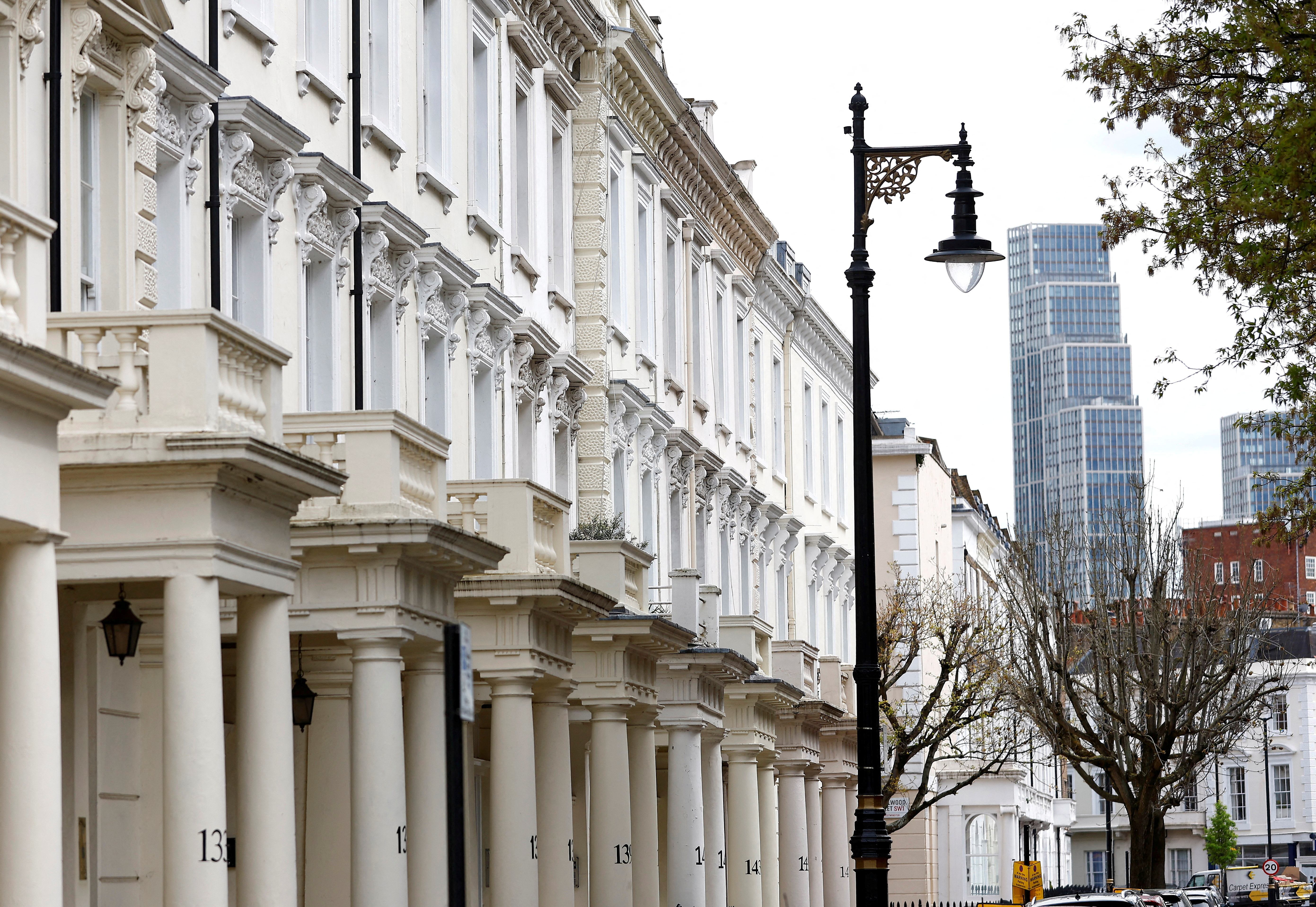 New apartment blocks are seen behind traditional housing in London