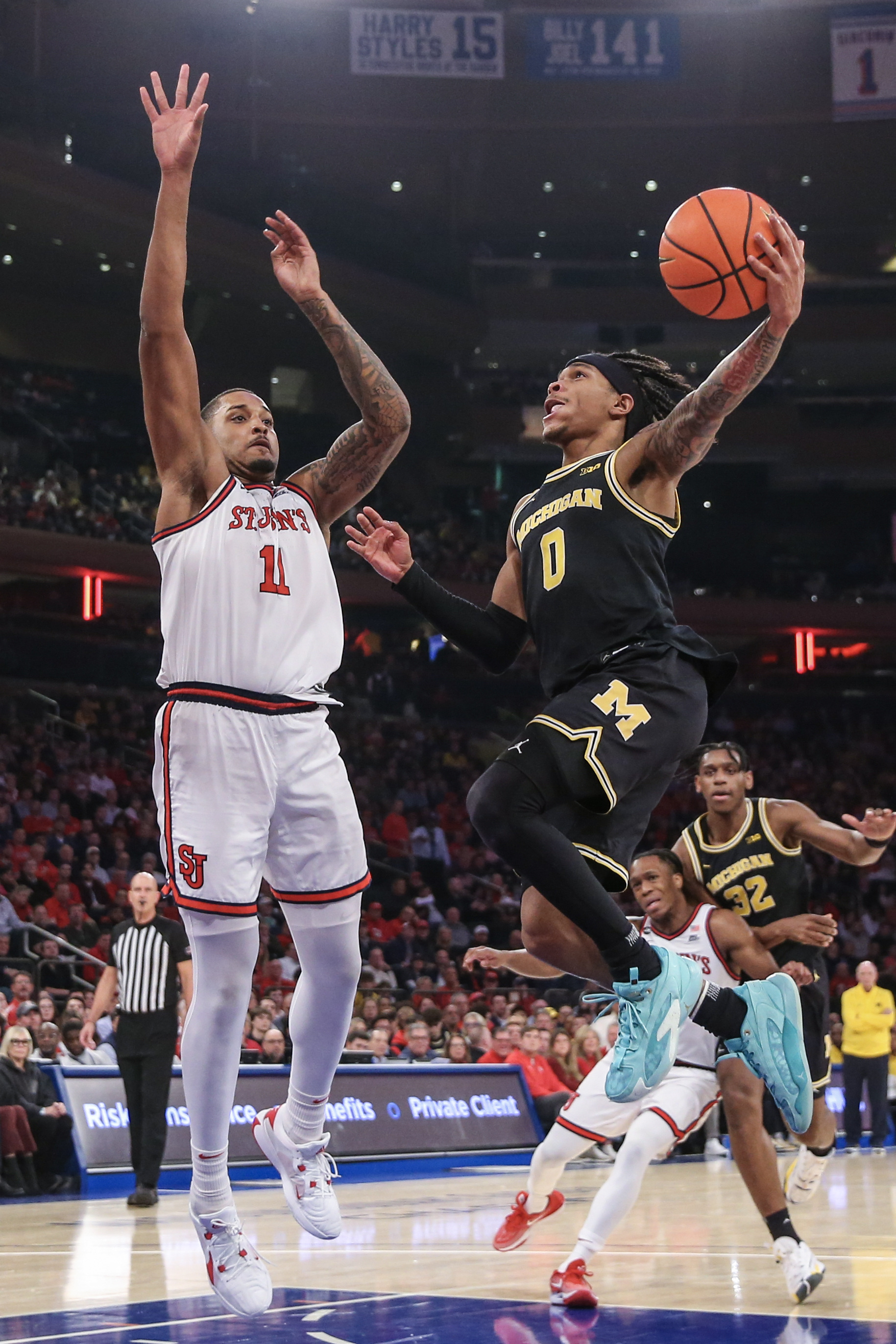 Dug McDaniel, Nimari Burnett Power Michigan Past St. John's | Reuters