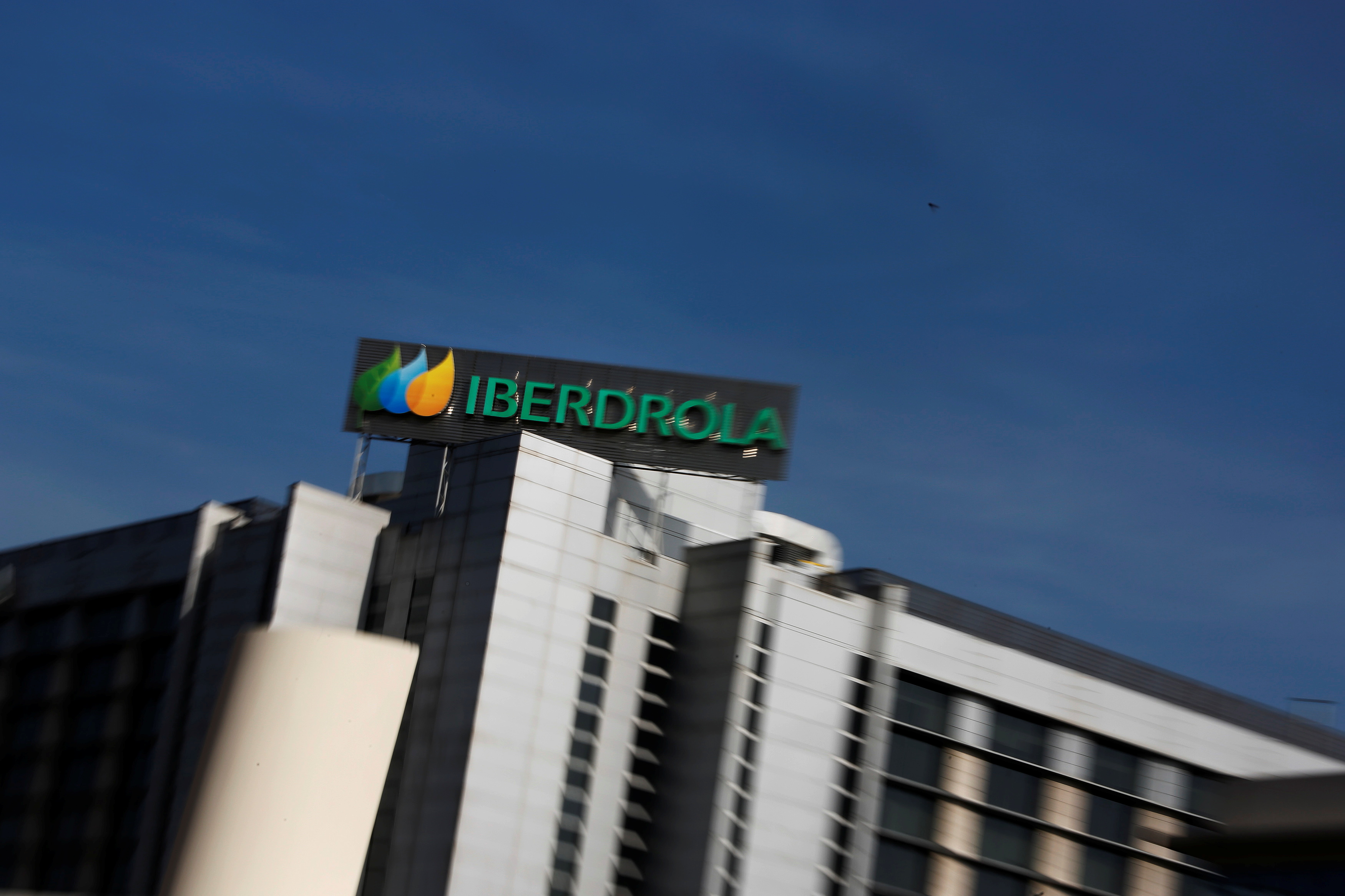 The logo of Spanish power company Iberdrola is seen on top of Iberdrola's main office building in Madrid