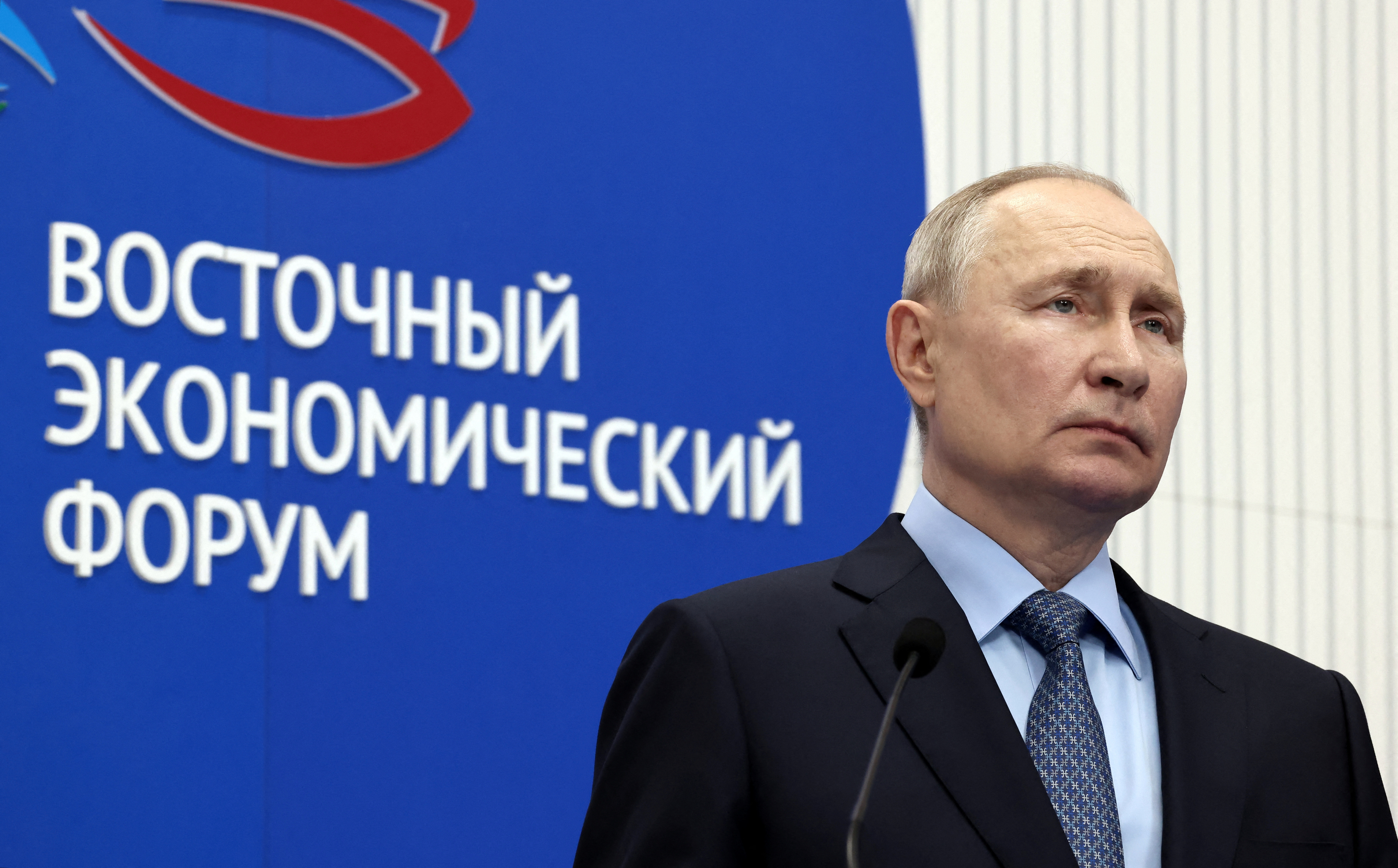 Russian President Vladimir Putin listens to a report in Vladivostok