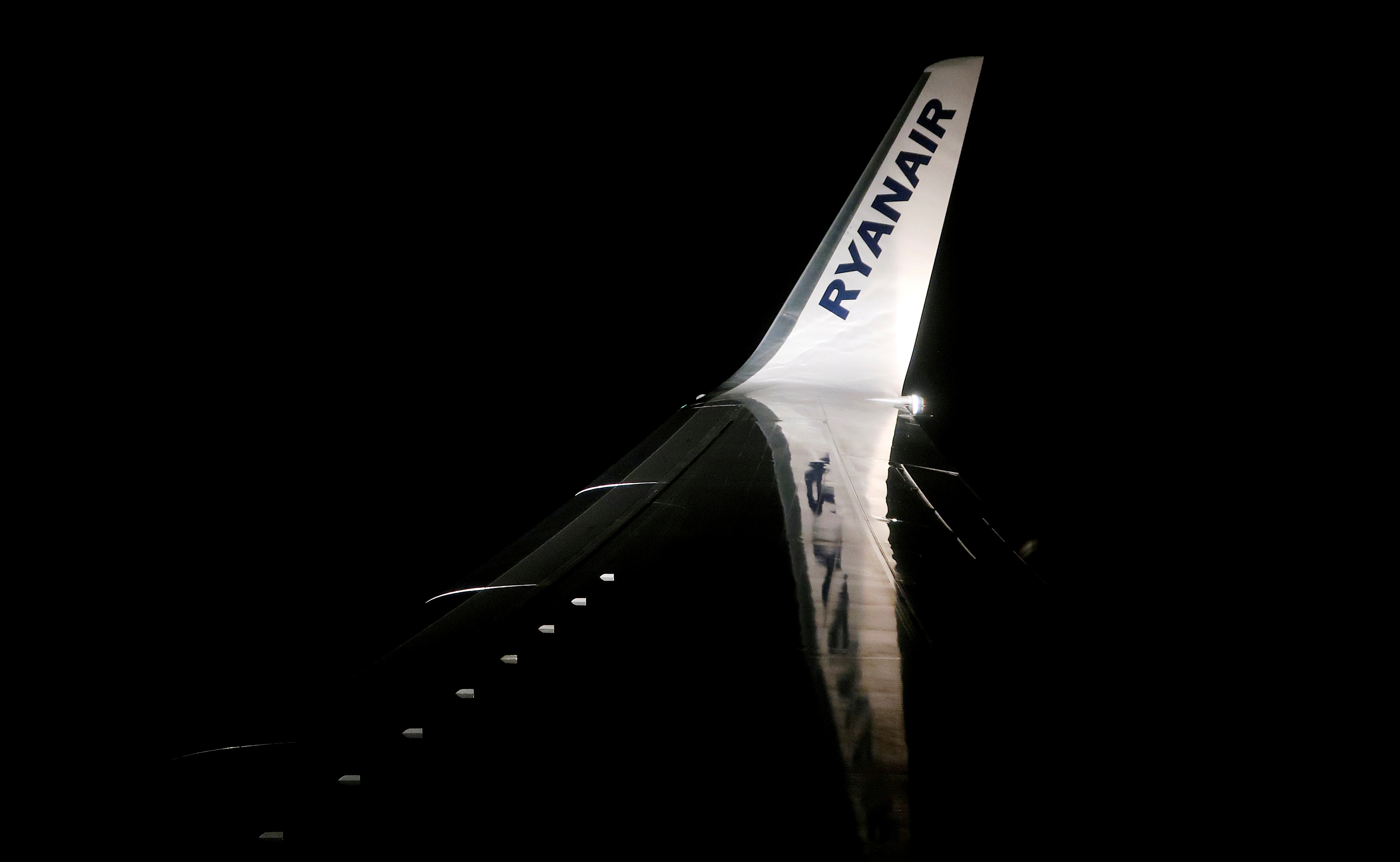 A Ryanair logo is seen on a wing of a passenger aircraft travelling from Madrid International Airport to Bergamo Airport, Italy