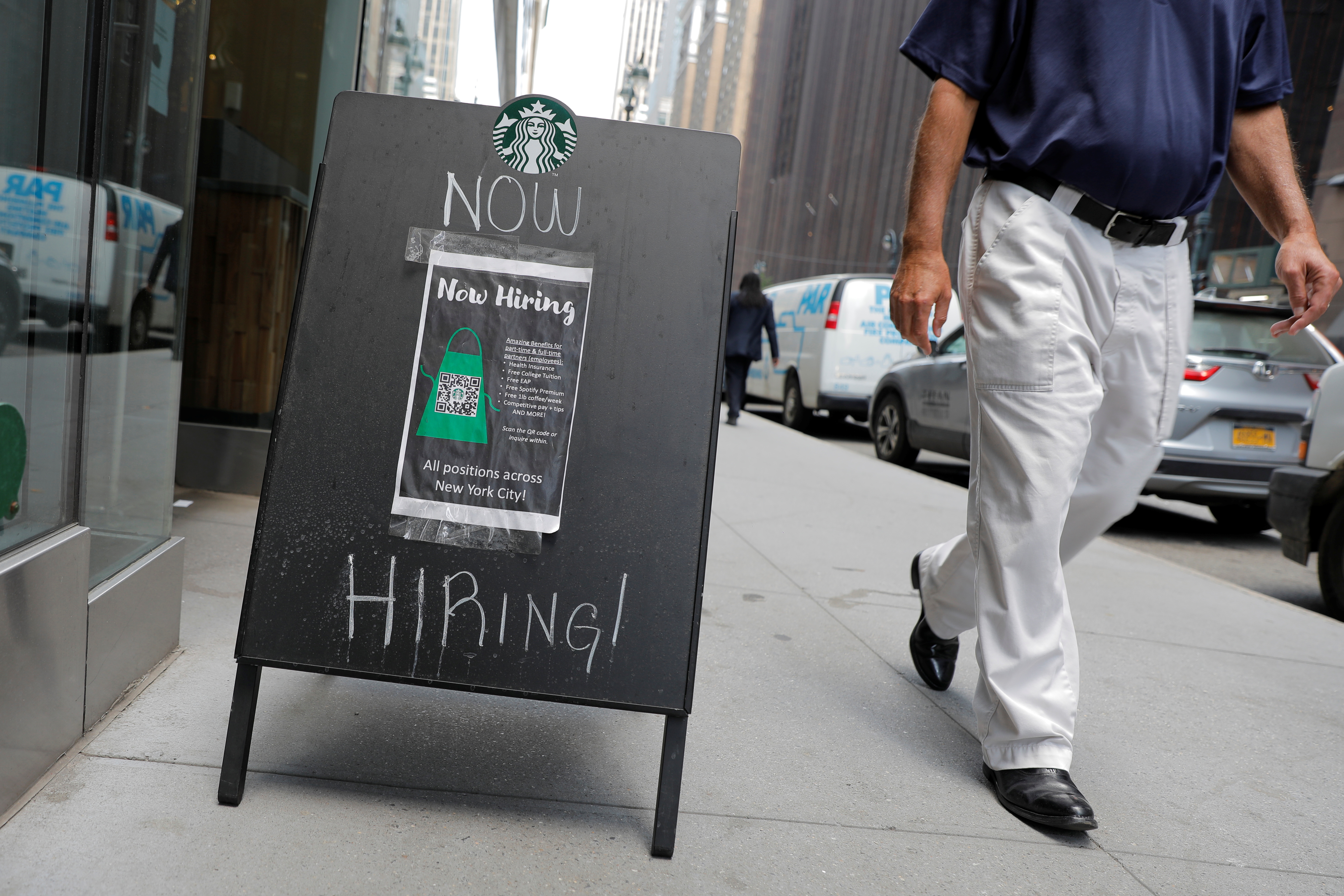 A sign advertising job openings is seen outside of a Starbucks in Manhattan, New York City, New York, U.S., May 26, 2021. REUTERS/Andrew Kelly