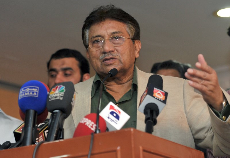 Former President of Pakistan Pervez Musharraf gestures during a news conference in Dubai