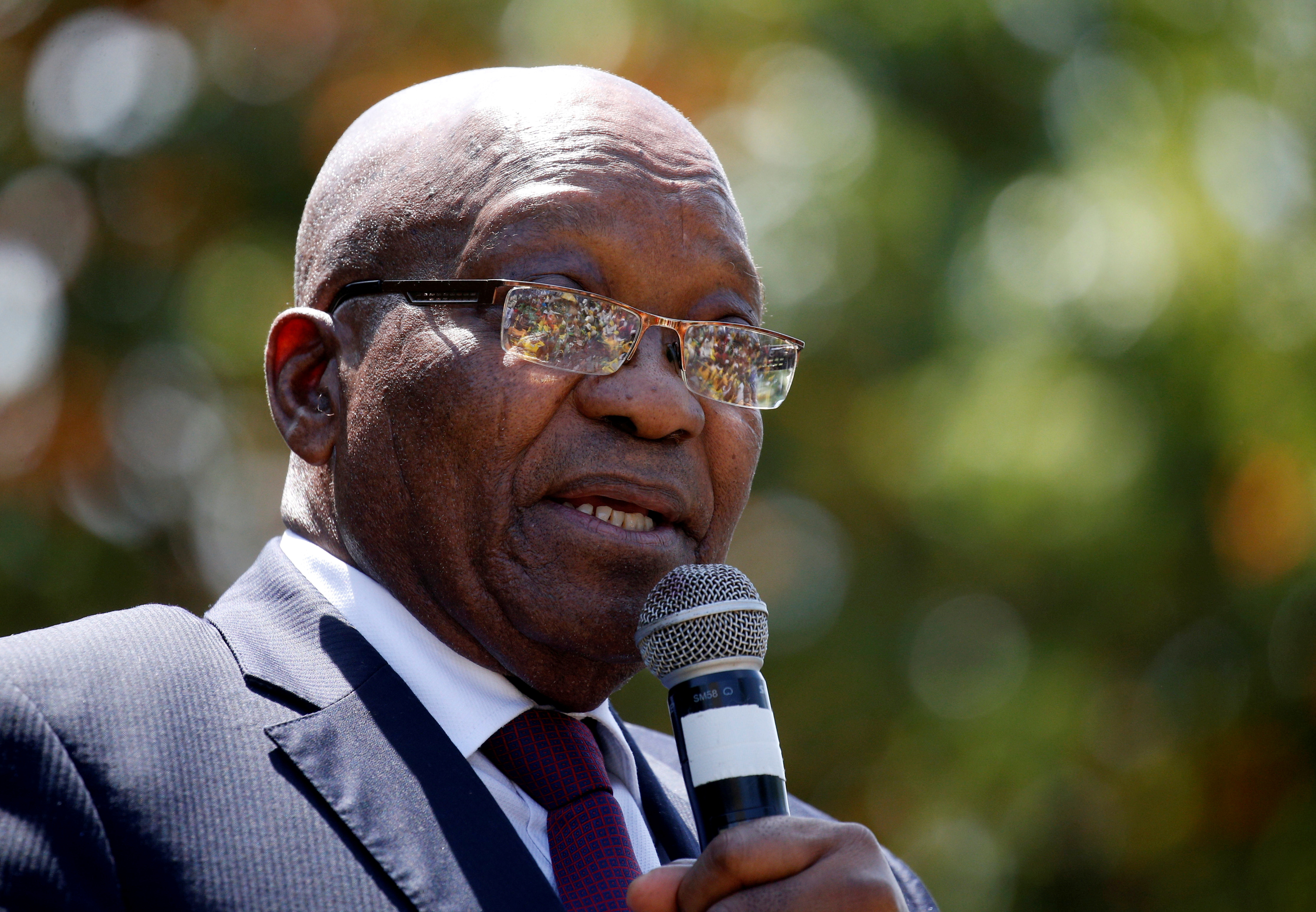 Former South African President Jacob Zuma speaks to supporters after appearing in the High Court where he faces charges that include fraud, corruption and racketeering, in Pietermaritzburg