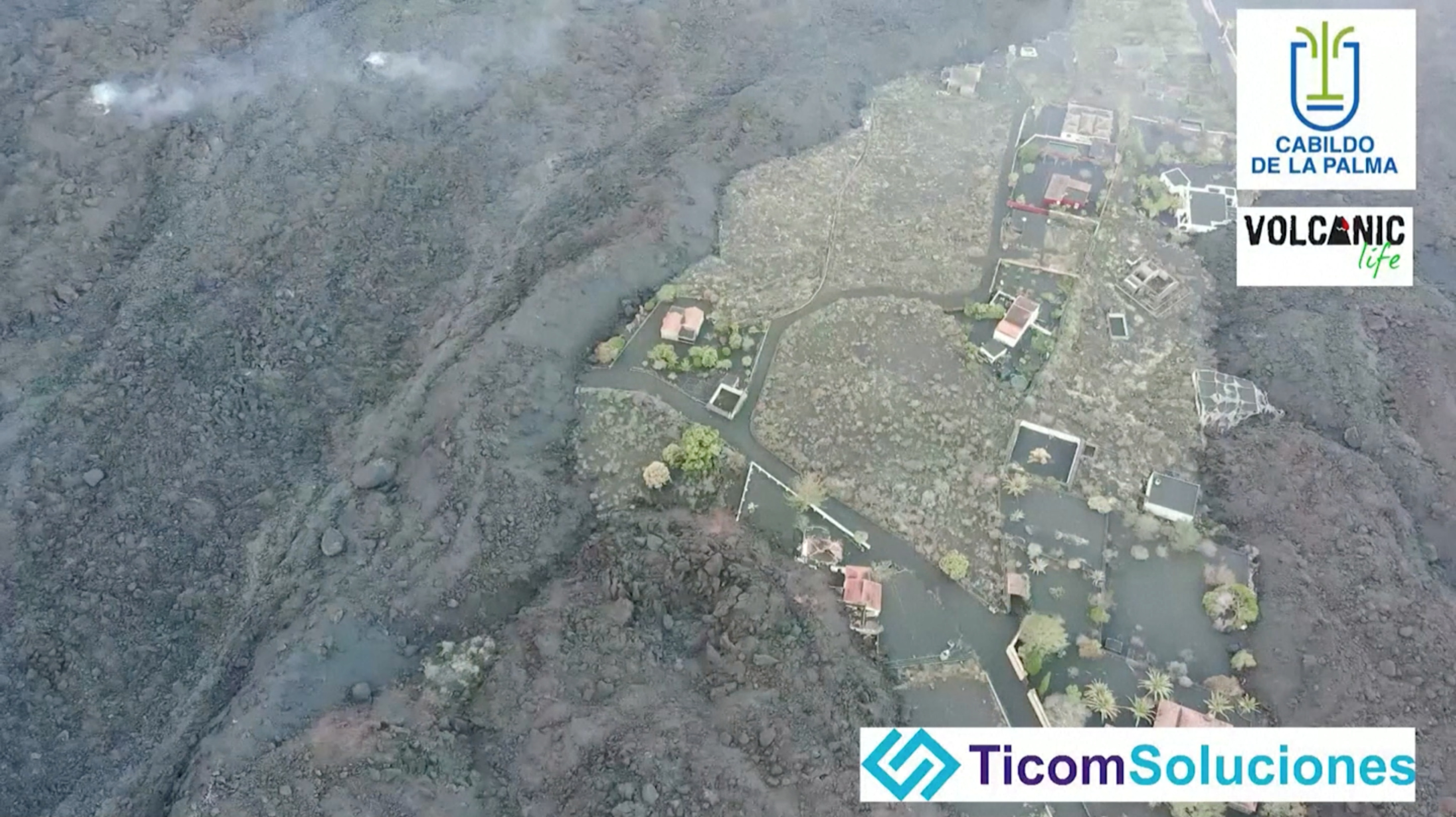General view of ash-covered earth surrounded by volcanic lava following an eruption of the Cumbre Vieja volcano, in the area of Todoque on the Canary Island of La Palma, Spain in this undated screen grab taken from a handout video. Video recorded with a drone. Handout via REUTERS   