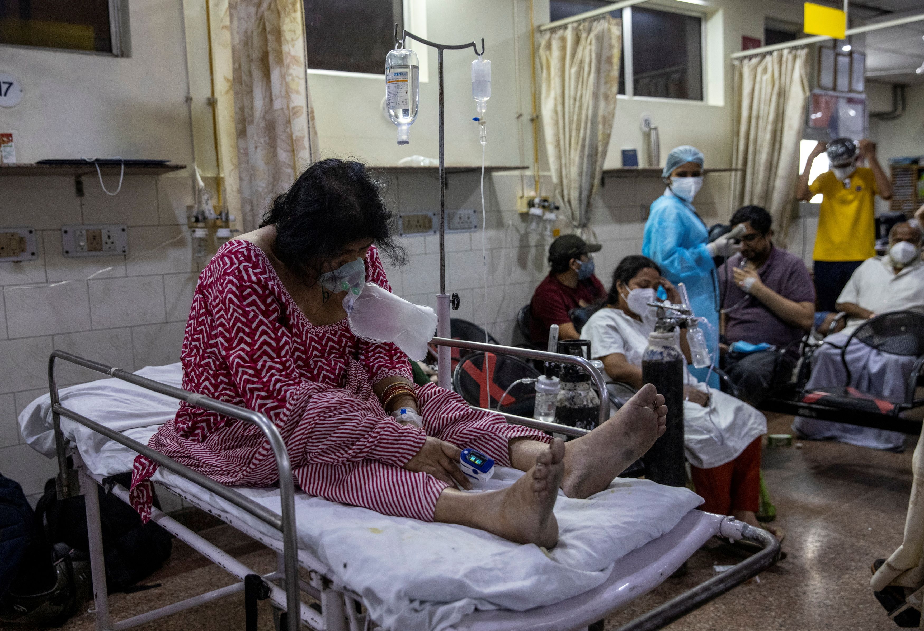 Patient suffering from the coronavirus disease (COVID-19) receives treatment inside the casualty ward at a hospital in New Delhi