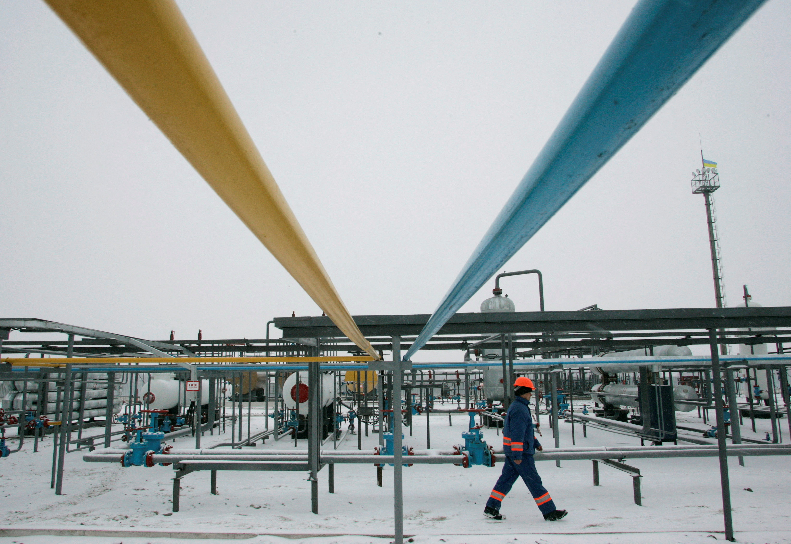 Employee walks at gas field in Lyvenske