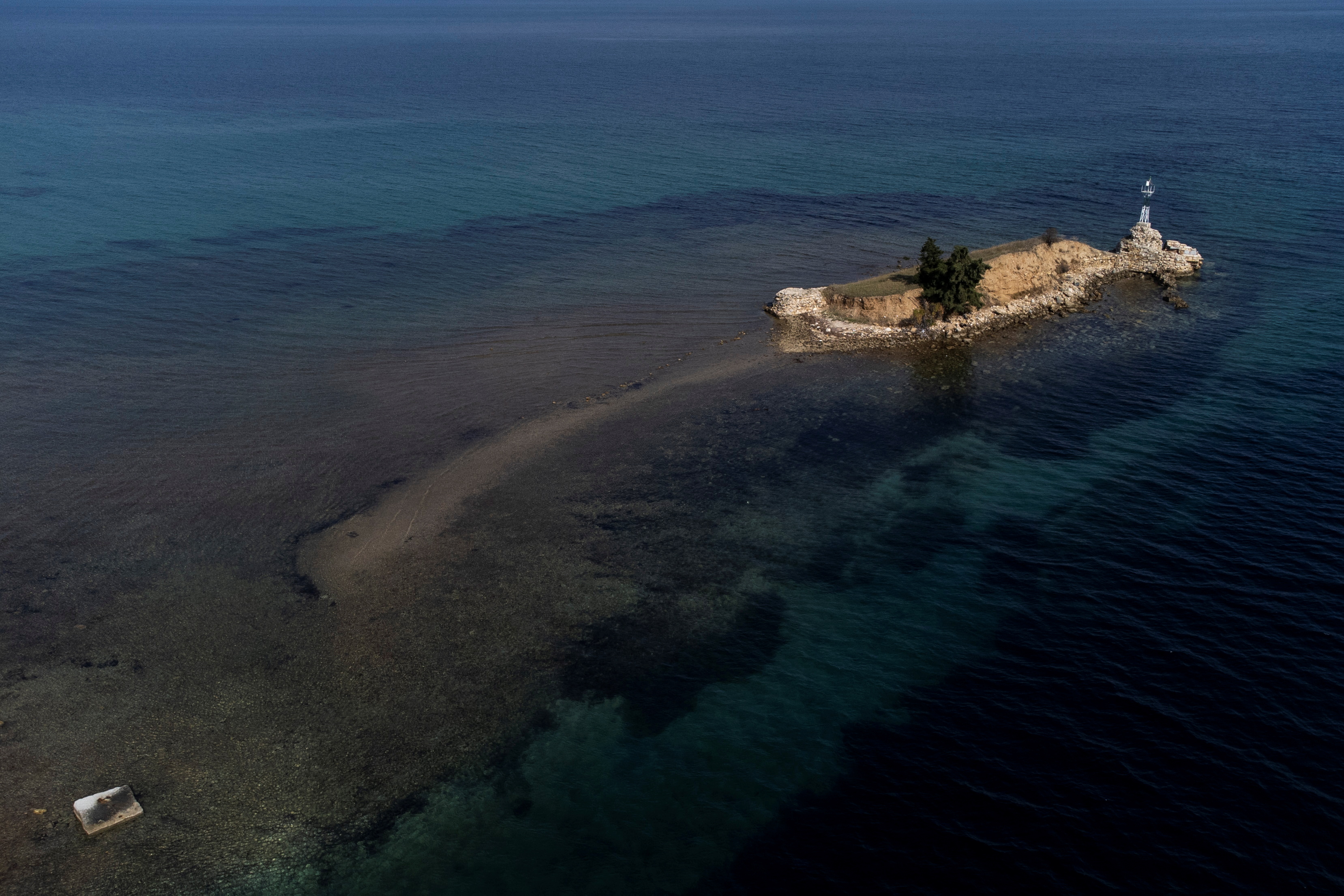 An aerial view shows a strip of land partly submerged at the village of Nea Potidea, Greece, October 20, 2021. Picture taken with a drone. REUTERS/Alkis Konstantinidis