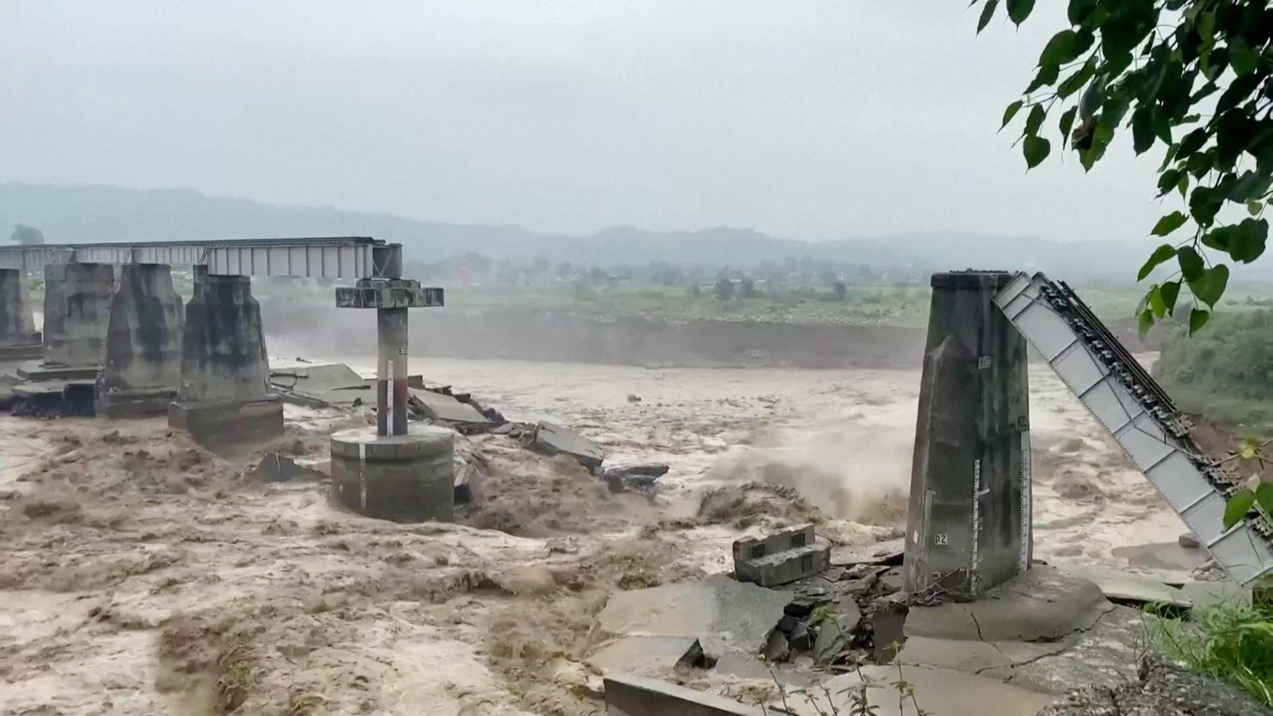 A general view of a bridge that collapsed following heavy rains in Kangra