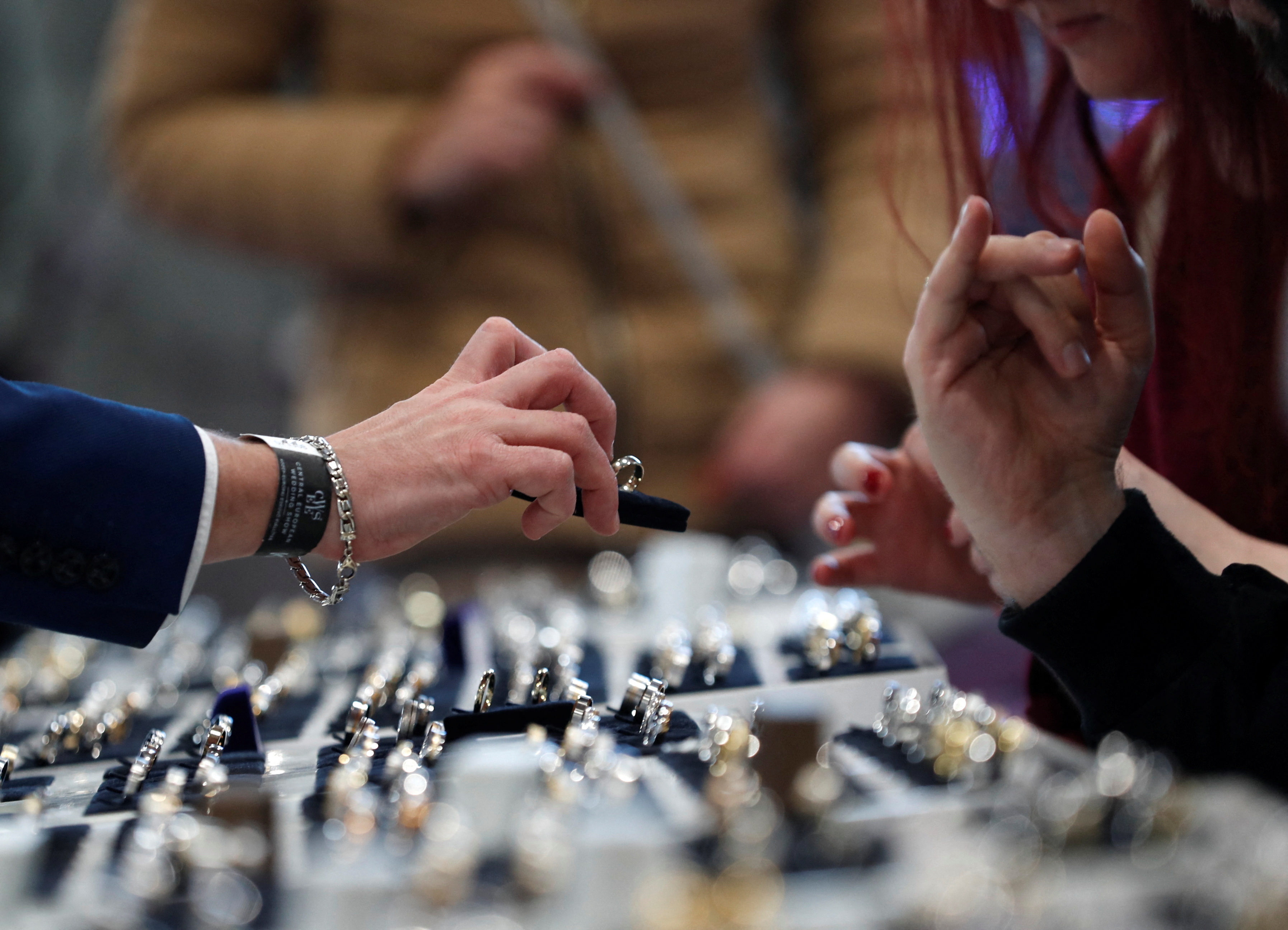 A vendor shows a wedding ring during the Central European Wedding Show in Budapest