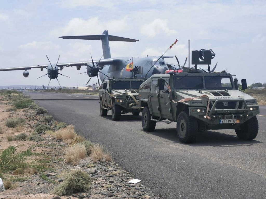 Spanish military plane and military vehicles depart on tarmac as Spanish diplomatic personnel and citizens are evacuated, in Khartoum