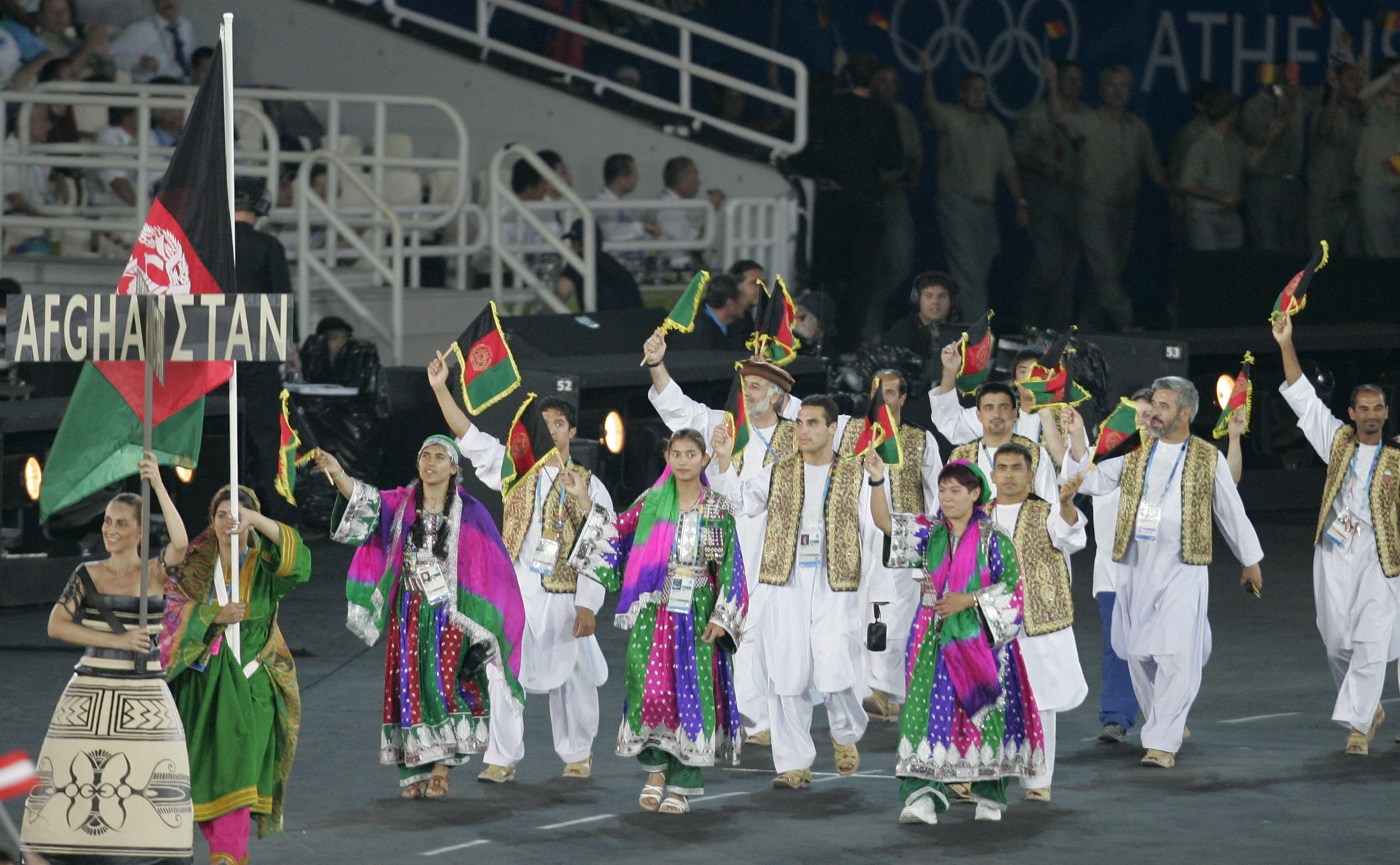 Afghanistan's Nina Suratger holds Afghanistan's national flag during the opening ceremony of the ...