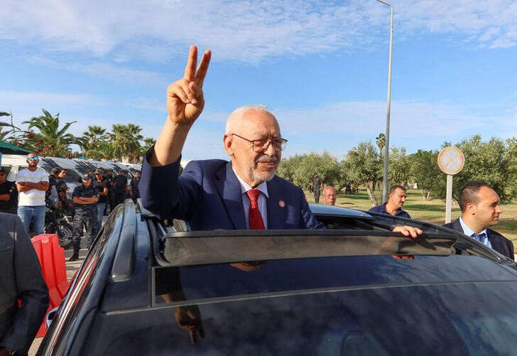 Islamist Ennahda party leader Rached Ghannouchi gestures outside Judicial Pole of Counter-Terrorism after a Tunisian judge postponed a terrorism hearing against him in Tunis