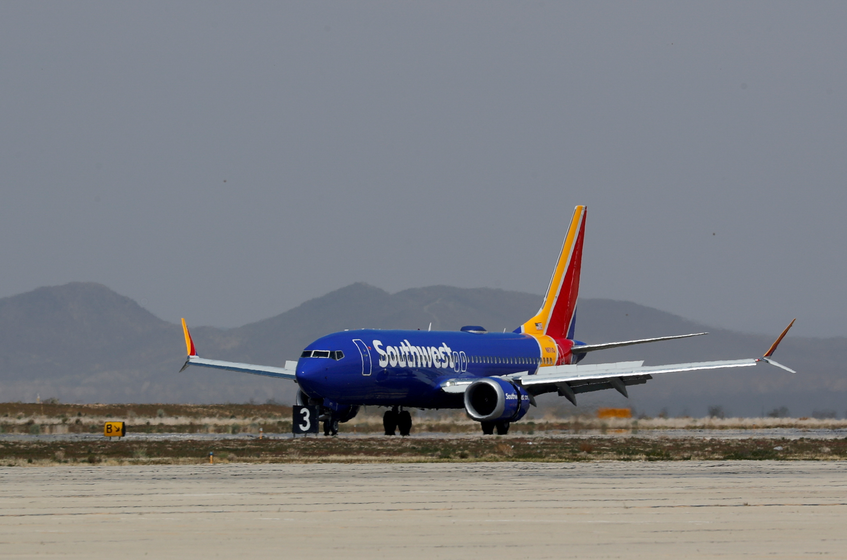 A Southwest Airlines Boeing 737 MAX 8 aircraft lands at Victorville Airport in Victorville, California