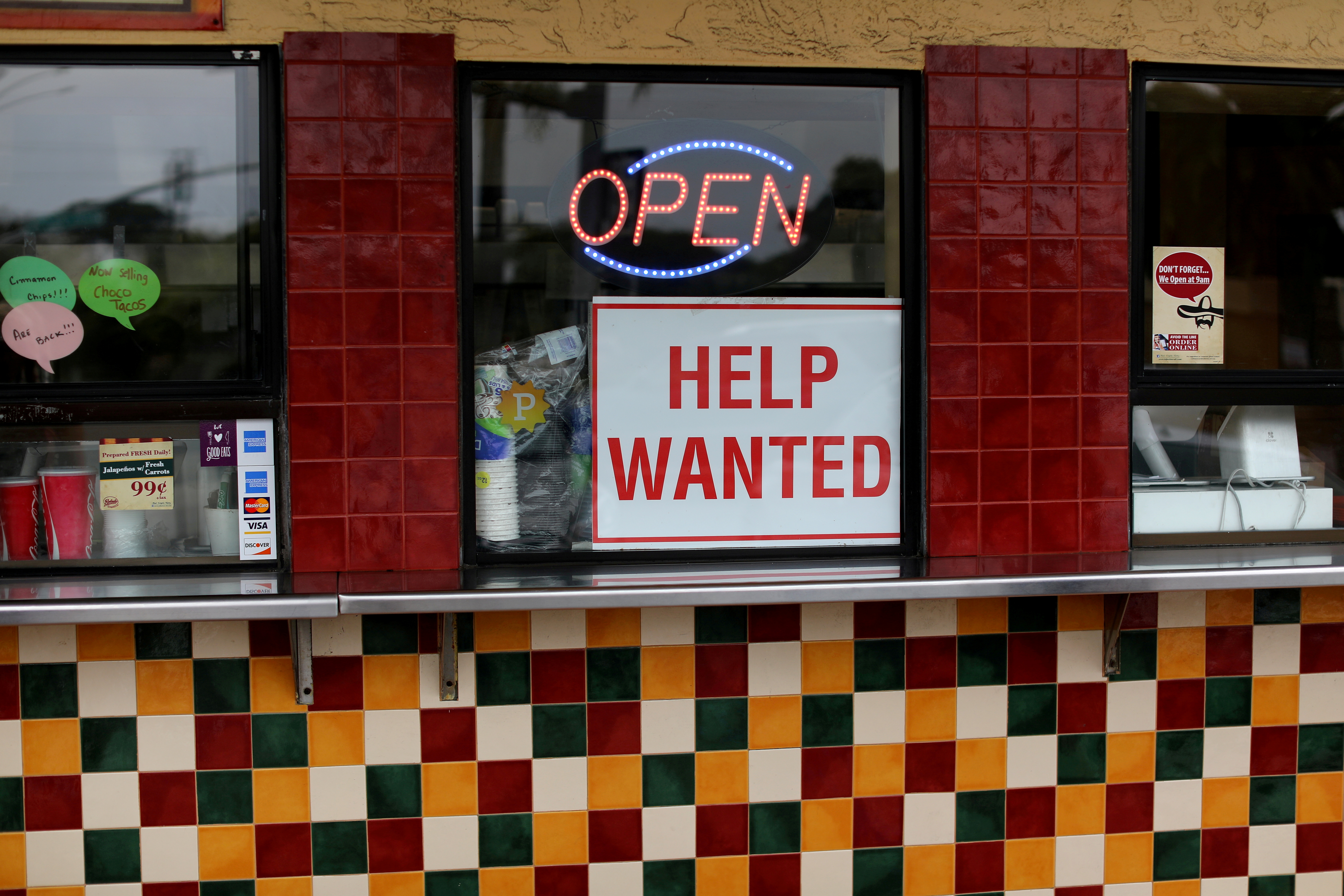 A help wanted sign is posted at a taco stand in Solana Beach, California, U.S., July 17, 2017