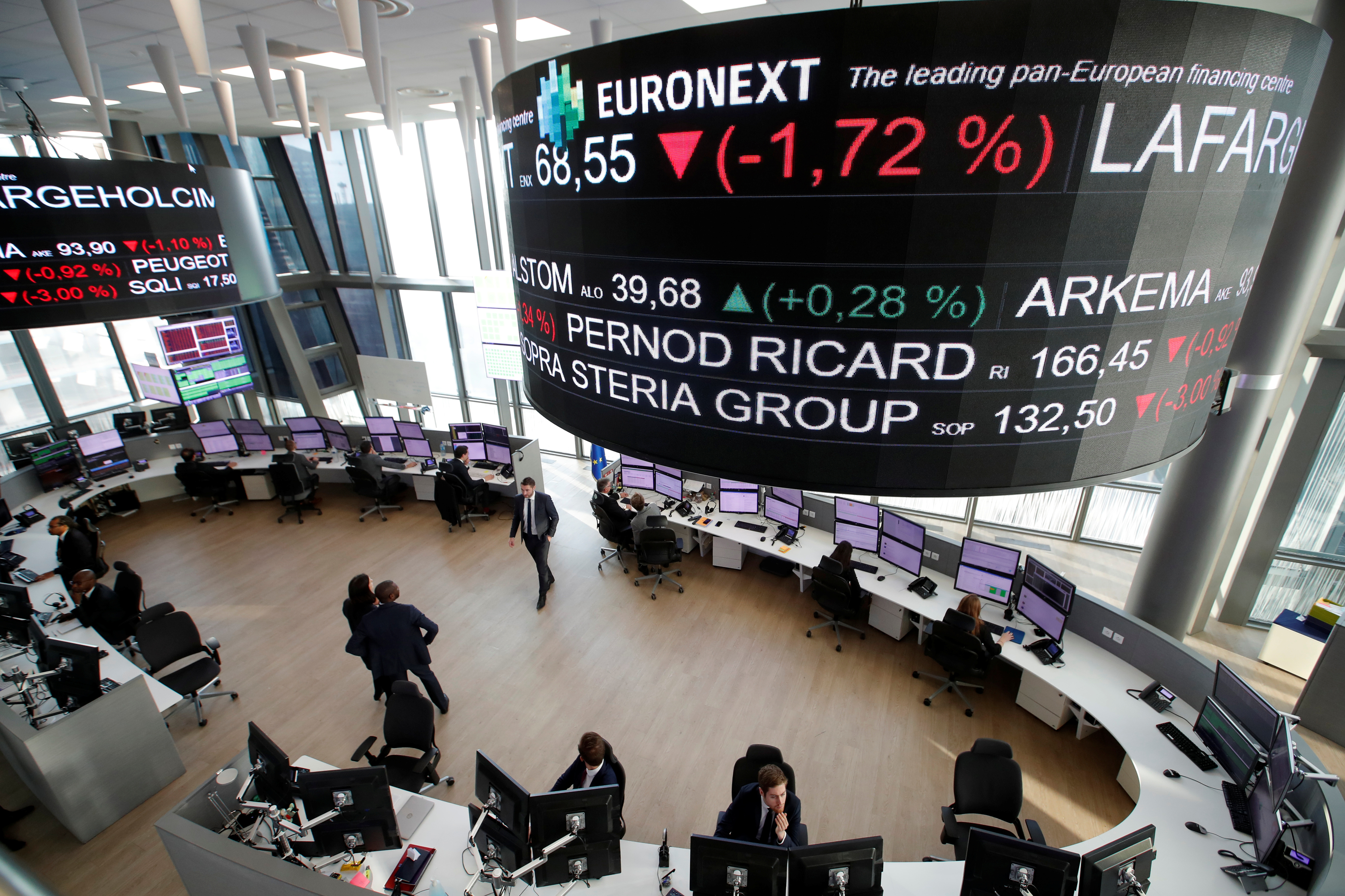 Stock market operators work at the Euronext headquarters at La Defense business and financial district in Courbevoie near Paris