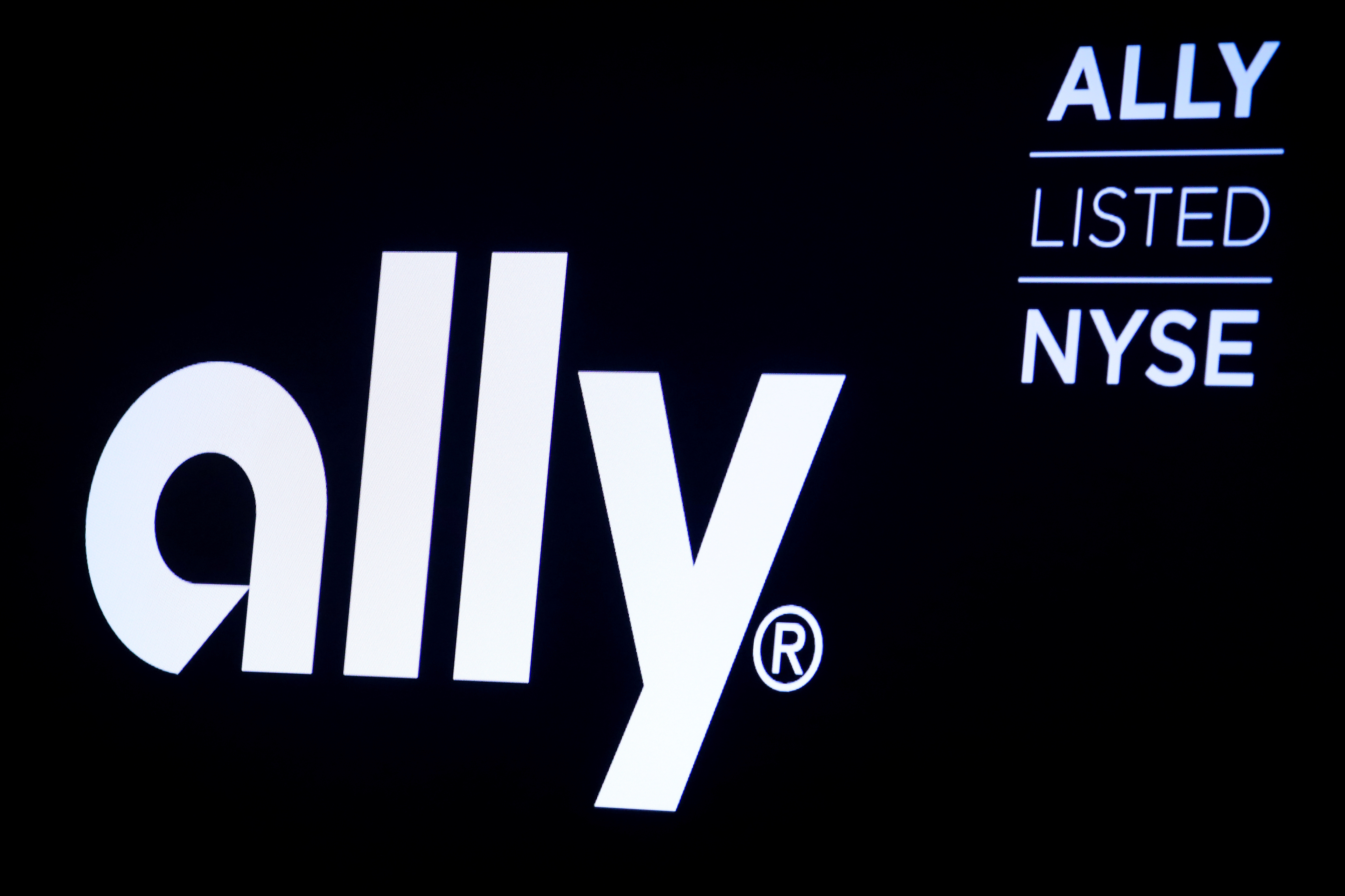 The logo and trading information for Ally Financial Inc appear on a screen on the floor at the NYSE in New York