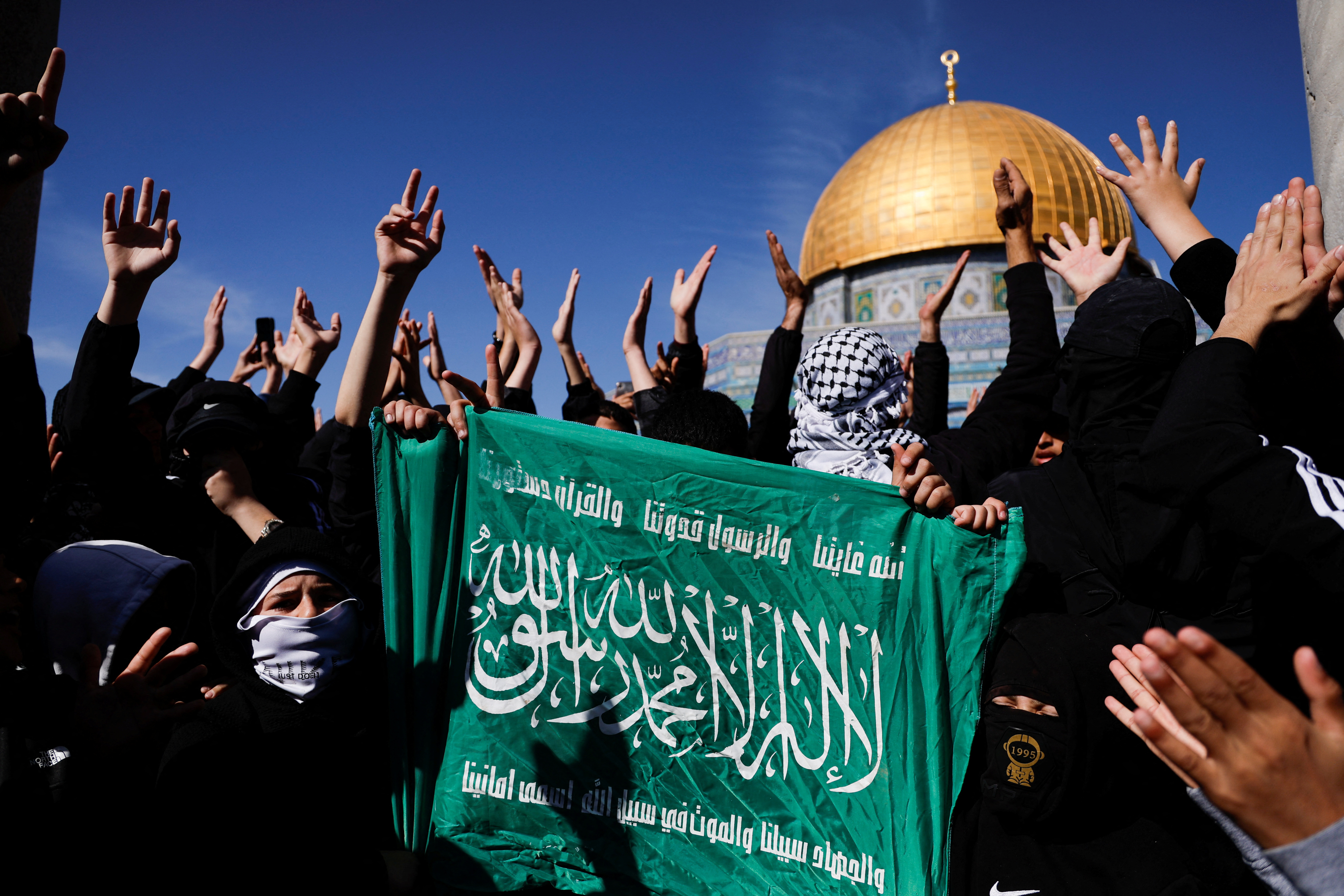 Palestinians protest recent activity in Gaza in front of the Dome of the Rock, in Jerusalem's Old City