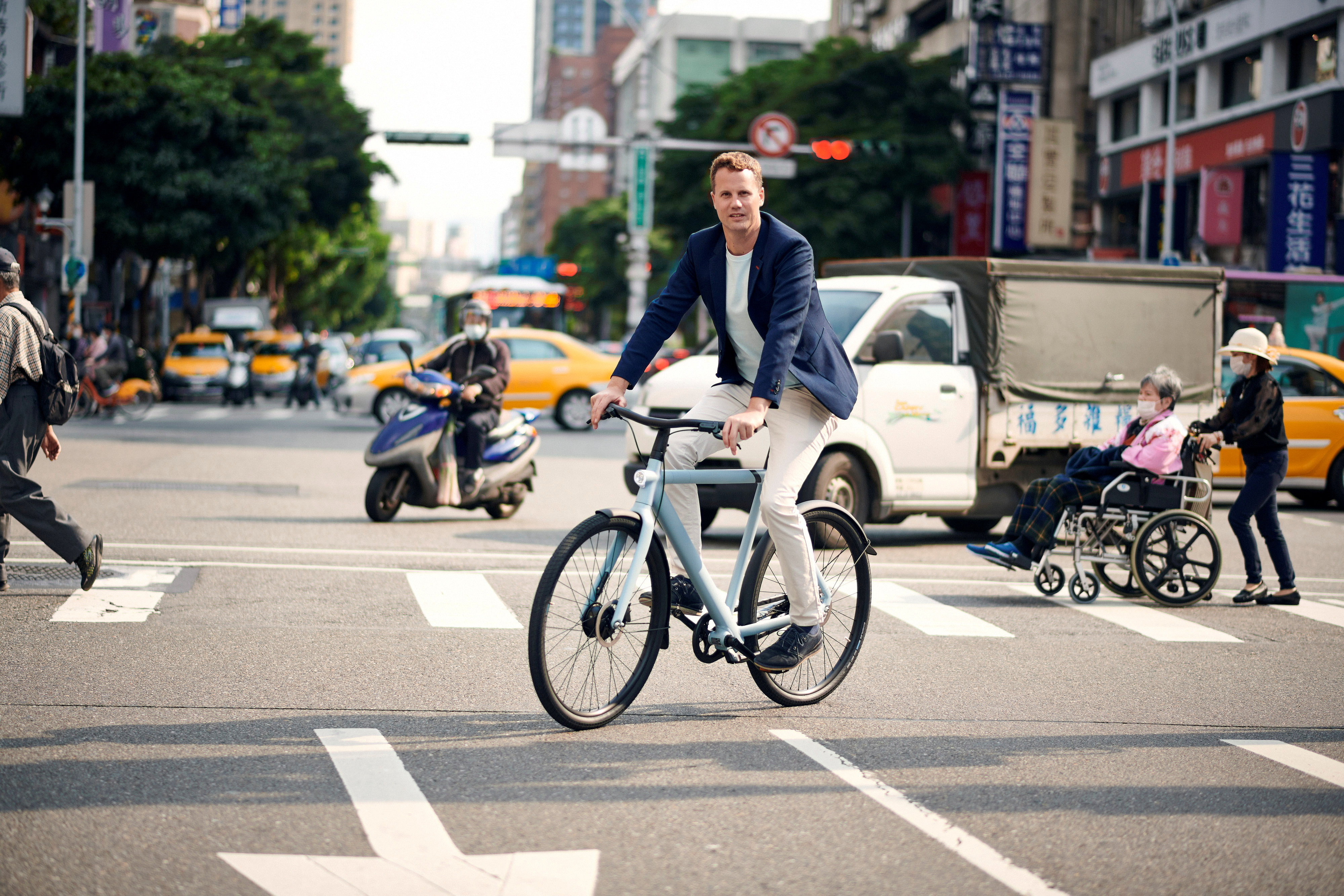 Ties Carlier, co-founder of Dutch electric bike maker Vanmoof, rides a bike