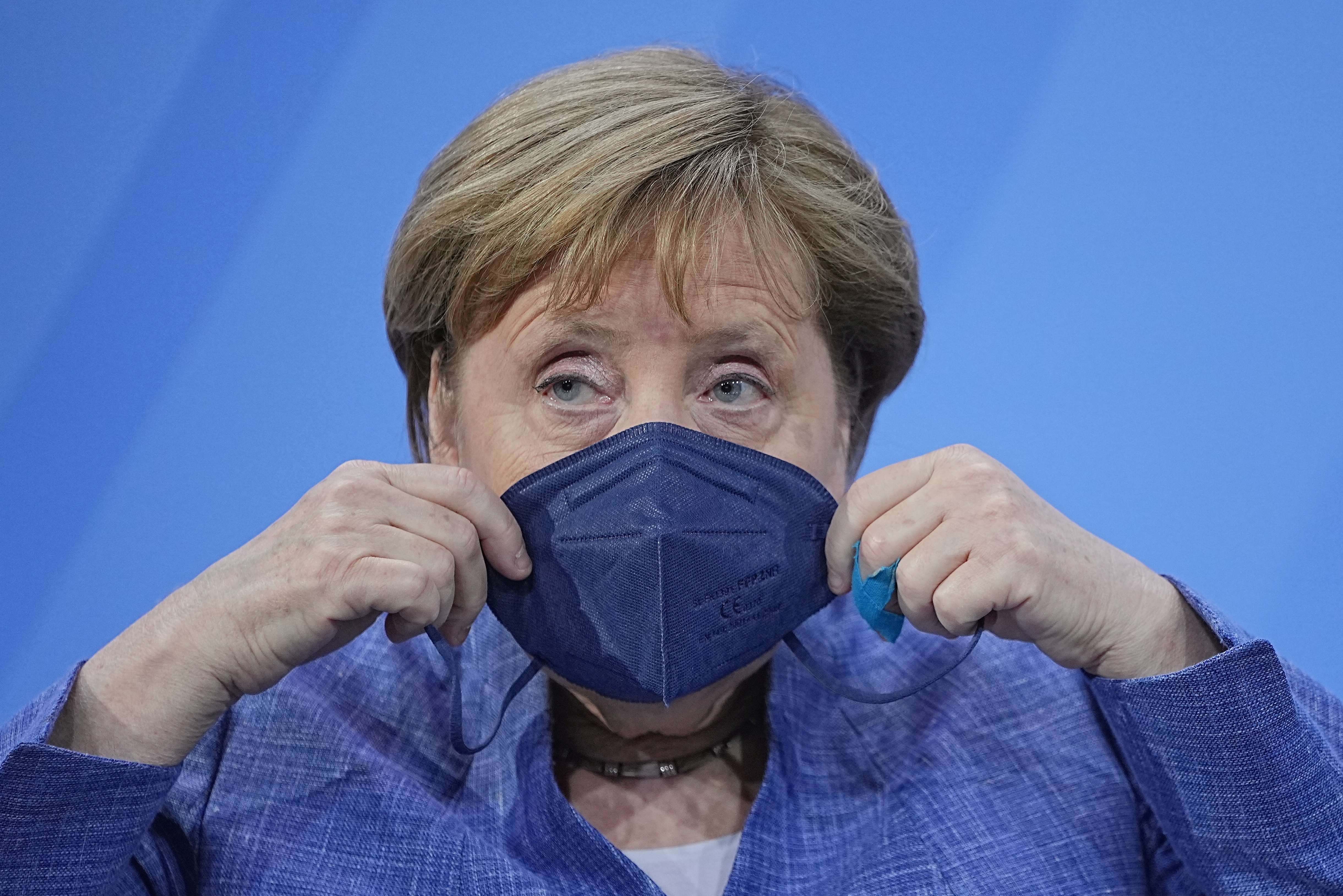 German Chancellor Angela Merkel wears her protective mask after a press conference following a meeting with the leaders of the country's 16 federal states to discuss COVID-19 polls in Berlin, Germany, June 10, 2021. Michael Kappeler / Pool via REUTERS