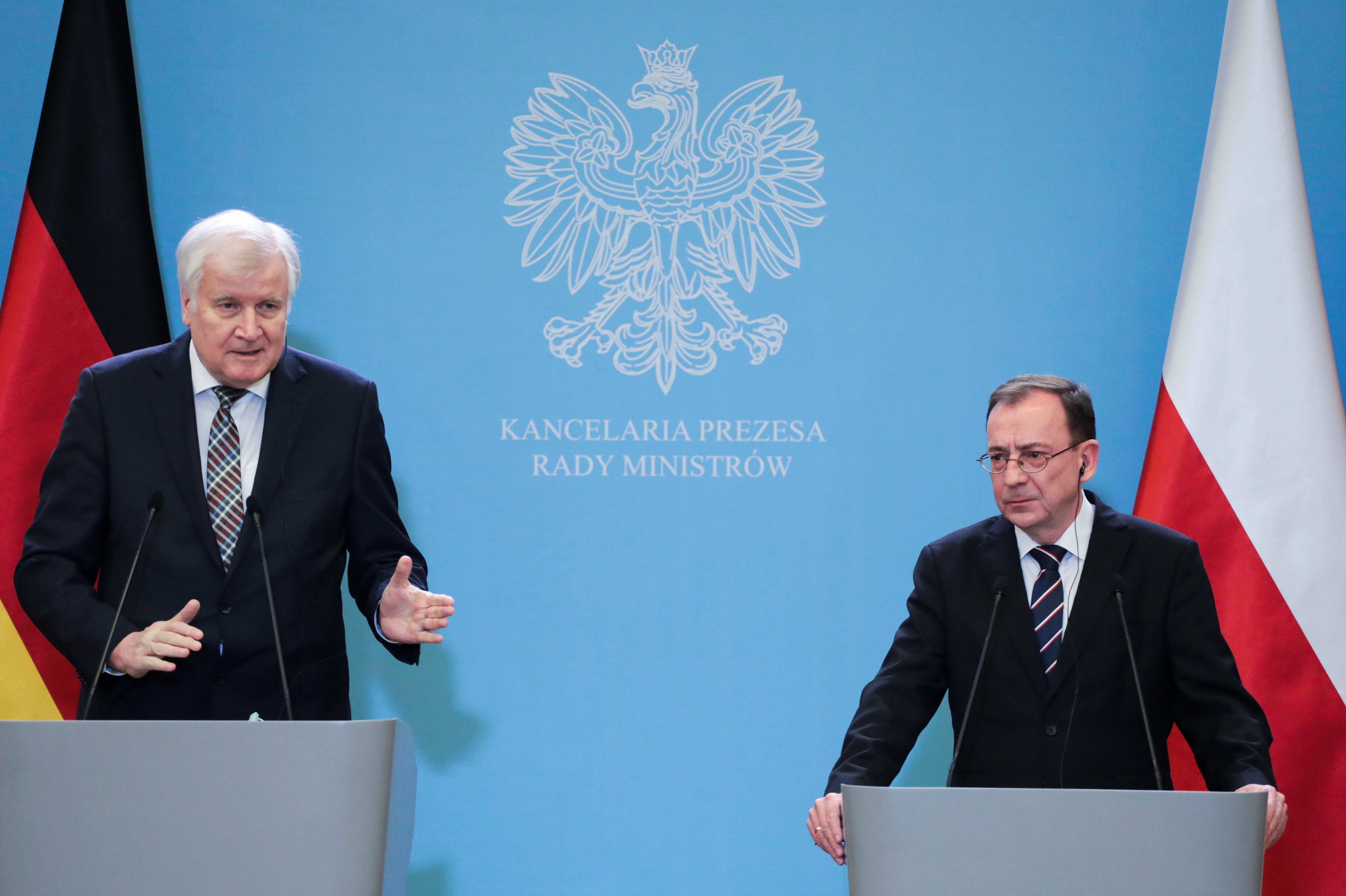 Germany's Interior Minister Seehofer and his Poland's counterpart Kaminski attend a news briefing in Warsaw