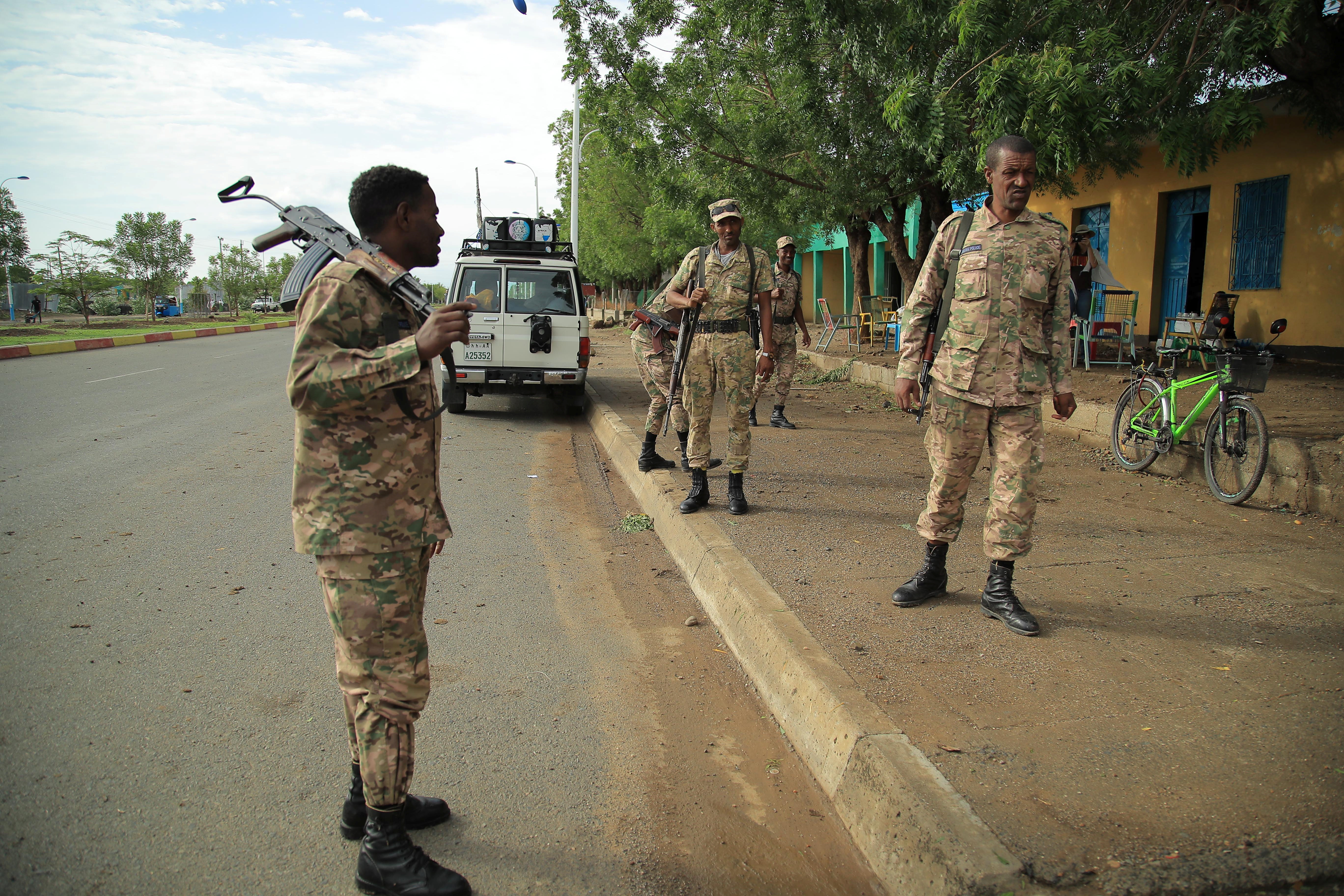 Members of Amhara Special Forces stand guard along a street in Humera town
