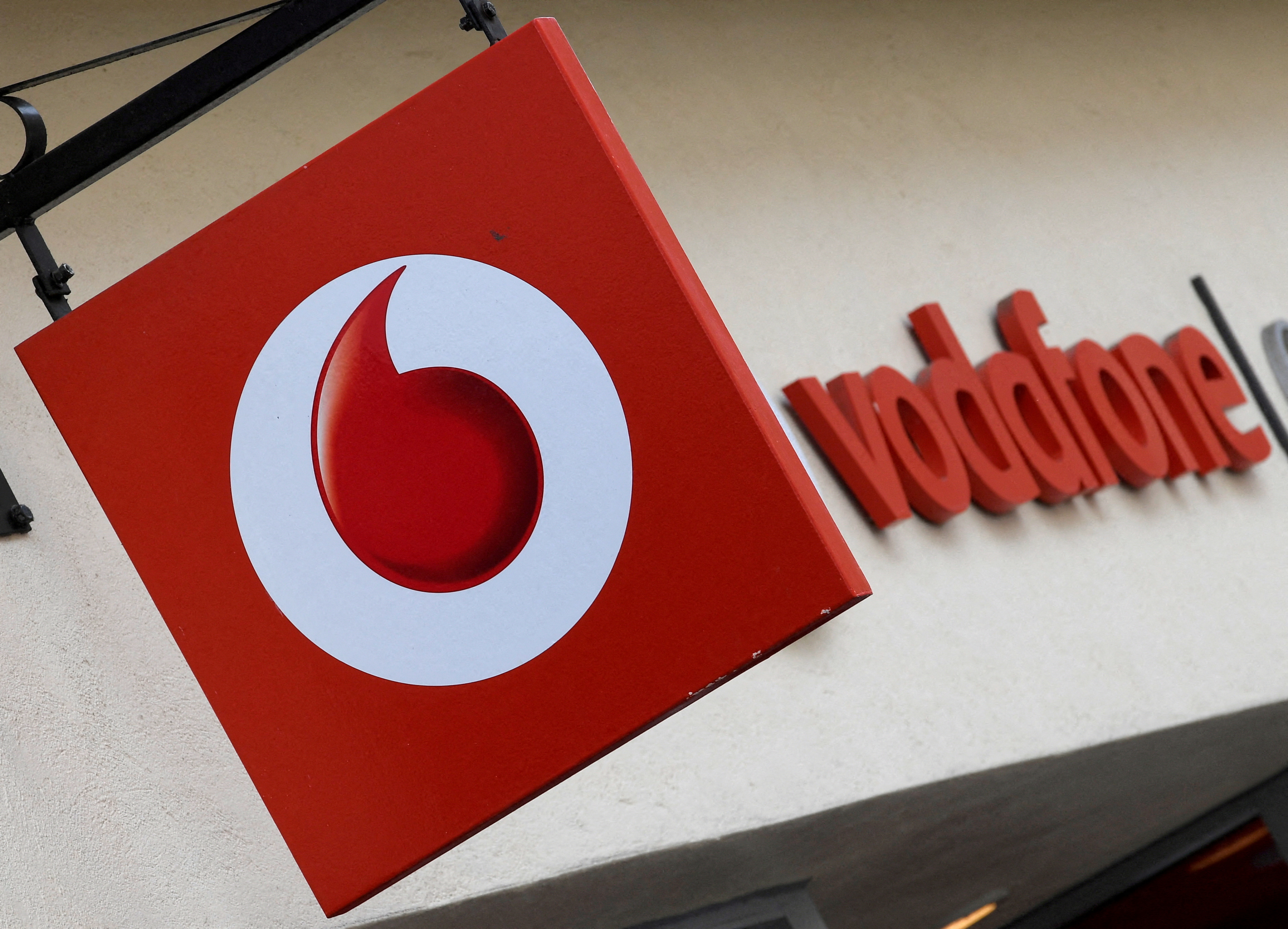 Branding hangs outside a Vodafone shop in Oxford