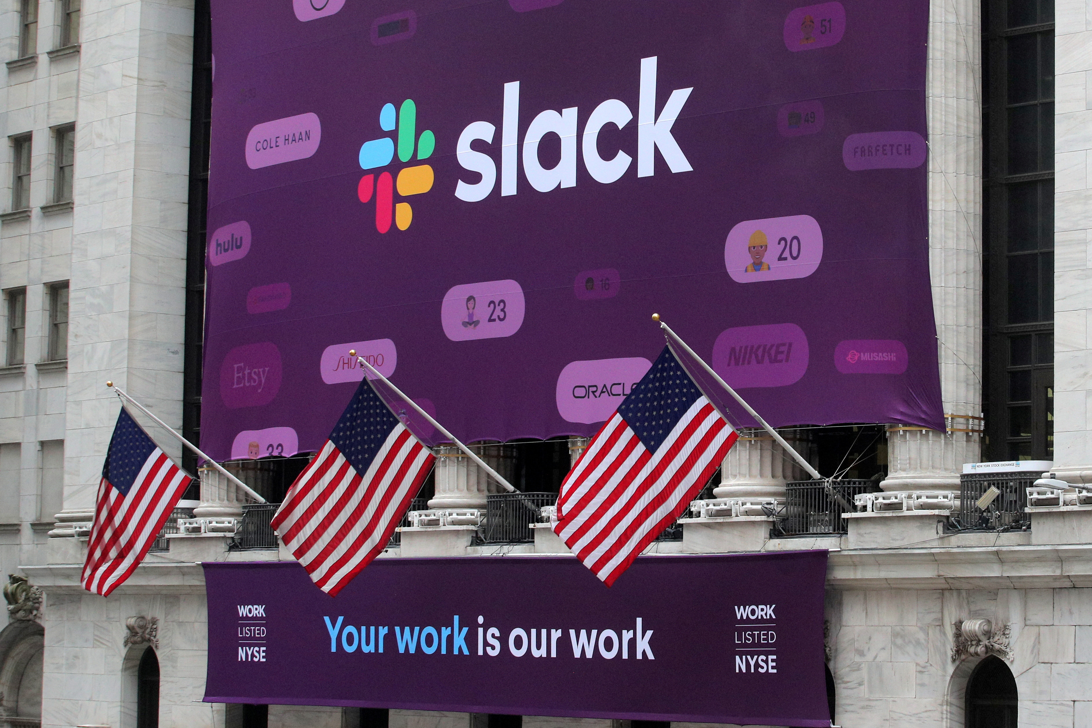 The Slack Technologies Inc. logo is seen on a banner outside the New York Stock Exchange (NYSE) during thew company's IPO in New York