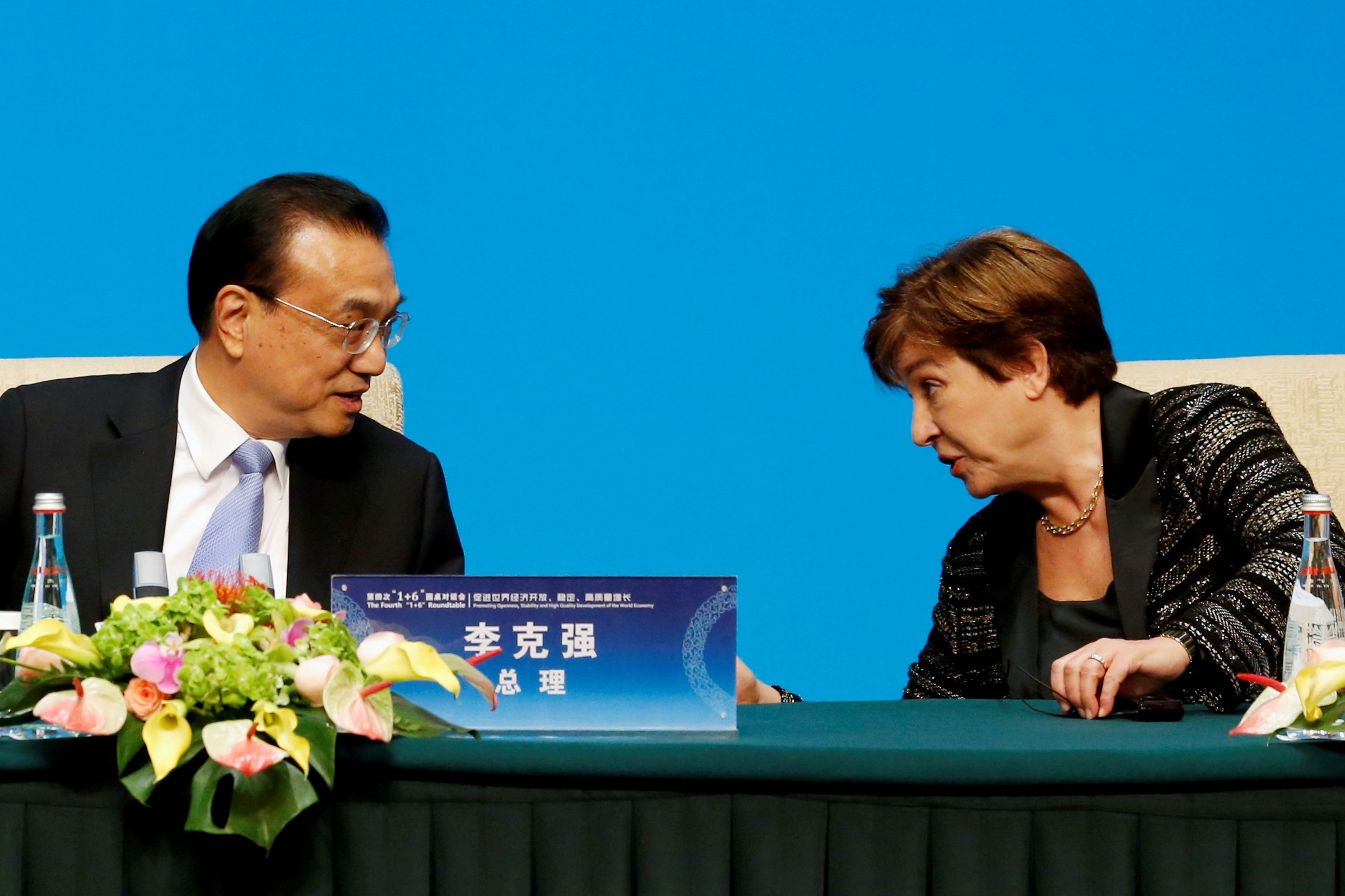 International Monetary Fund (IMF) Managing Director Kristalina Georgieva talks to Chinese Premier Li Keqiang before a news conference following the 