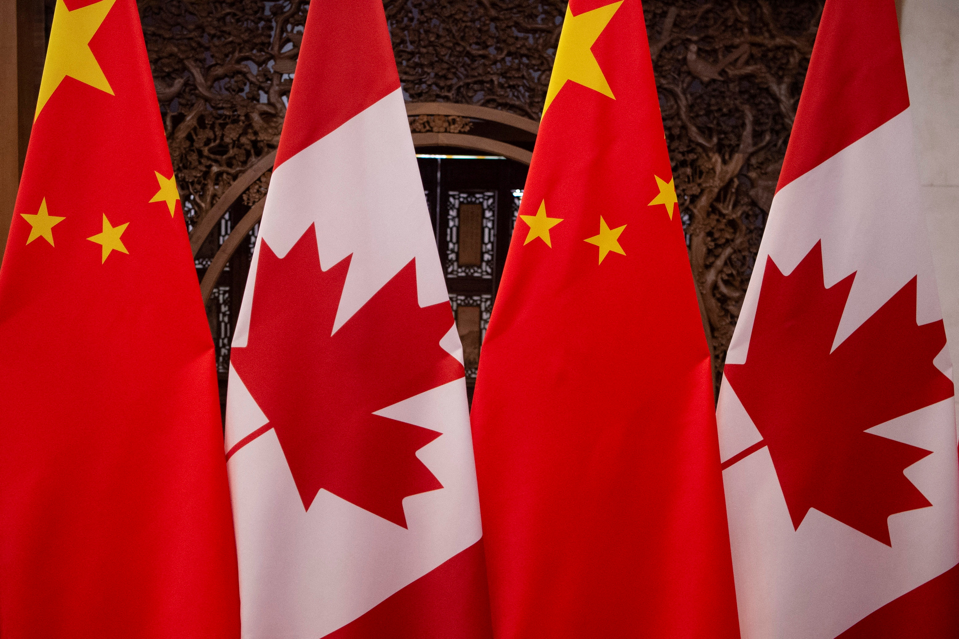 Picture of Canadian and Chinese flags taken prior to the meeting with Canada's Prime Minister Justin Trudeau and China's President Xi Jinping at the Diaoyutai State Guesthouse